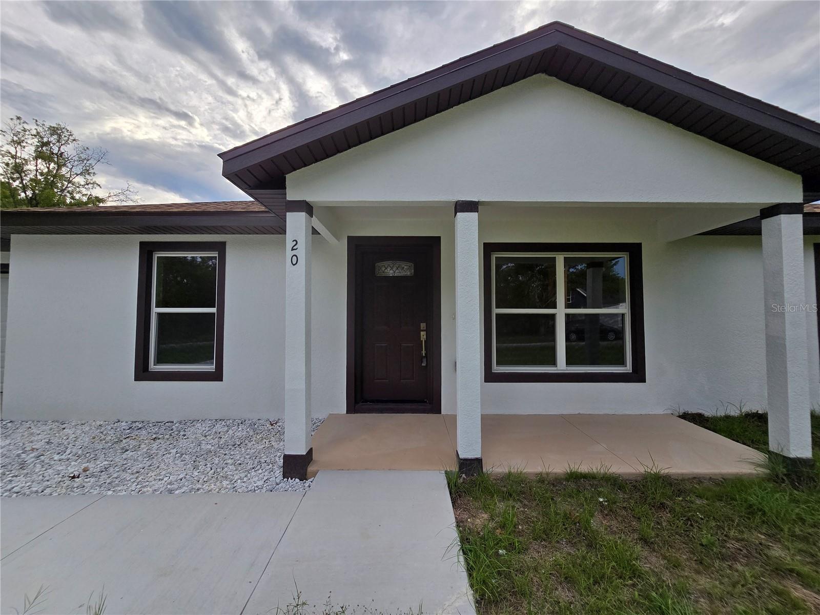 FULLY BUILT AND READY FOR MOVE IN! Welcome home to this beautifully done 3 bedroom 2 bathroom home in the popular silver springs shores area. As you enter the property, you will see the living room, kitchen and the split plan with the primary bedroom on the left. The primary bedroom features an oversized closet with an en suite bathroom with ez entry shower, granite counter and large mirror to get ready for the day. Vinyl flooring through the whole home, there is no carpet at all! On the right side of the home, the additional bedrooms are generously sized and will share the guest bathroom that has the matching granite counters and a tub. Linen closet is on the hallway, easily accessible for their needs. The kitchen has the same matching granite as the bathrooms and the window ledges and features a stainless steel appliance package with stove, microwave, dishwasher and refrigerator. Large pantry & whisper quiet drawers and cabinets are standard in this beautiful home. Off of the kitchen, is the dining room space leading to both the outside with upgraded sliding doors and the laundry room and garage. Well sized yard, look for the pink flags at the corners of the lot so you can have an idea. There's room for a pool, workshop, fence and still have grass to mow. No HOA, so there is room for all of your toys with no rules on what you can park where! On well and septic so no added utility bills. If you have electric, you have utilities! Close to springs, lakes & outdoor trails. In a USDA eligible area, so there could be zero down to move in! Come see this one today!
