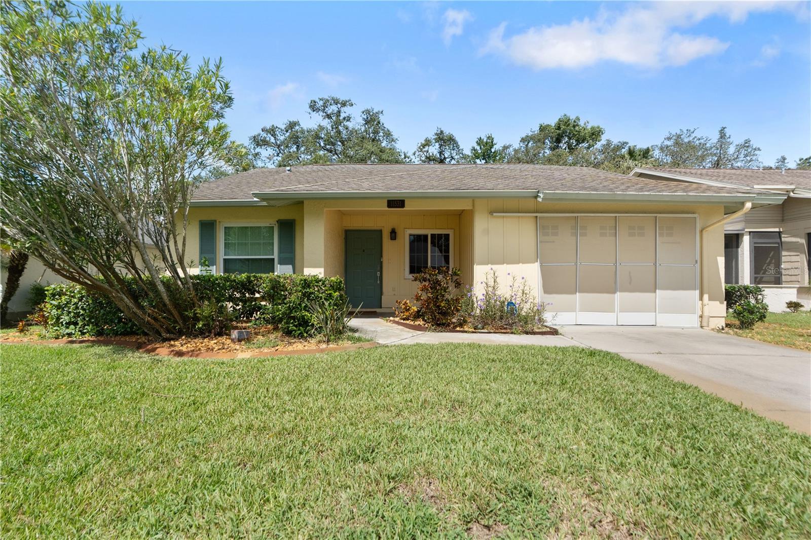 Discover the epitome of maintenance-free living in this vibrant 55+ gated community, thoughtfully designed for an active lifestyle.
The homeowners' association makes life easy by covering a wide range of services, including basic cable, Wi-Fi, trash and recycling, as well as full lawn care—such as irrigation, shrub trimming, and even exterior painting.
Enjoy an impressive lineup of recreational amenities including a community pool, fitness center, golf course, tennis courts, full-service spa, steam rooms, saunas, and more. Stay social and engaged with features like a billiards room, bocce ball courts, pickleball, shuffleboard, horseshoes, a card room, a craft room, and a well-stocked library.
The clubhouse is the heart of the community, hosting a variety of events and activities—dances, dinners, and social gatherings that keep the calendar full year-round.
This beautifully maintained home offers two bedrooms, two bathrooms, and a one-car garage, highlighted by a spacious open floor plan with cathedral ceilings. Additional features include a cozy den, an eat-in kitchen, and split bedrooms for added privacy.
Expand your living space with sliding doors that lead to a large, heated and cooled Florida room—perfect for relaxing while enjoying serene views and frequent wildlife sightings. This bonus room is not included in the home's listed square footage.
Recent updates provide peace of mind, with a roof replaced in 2016, windows upgraded in 2018, a five-year-old water heater, and newer appliances.
Ideally located just minutes from shopping, dining, and beautiful beaches, with convenient access to US-19 and the Suncoast Parkway—this home offers the best of the Florida lifestyle.
Don’t miss this incredible opportunity—schedule your private showing today and start living your best life in a community that truly has it all!