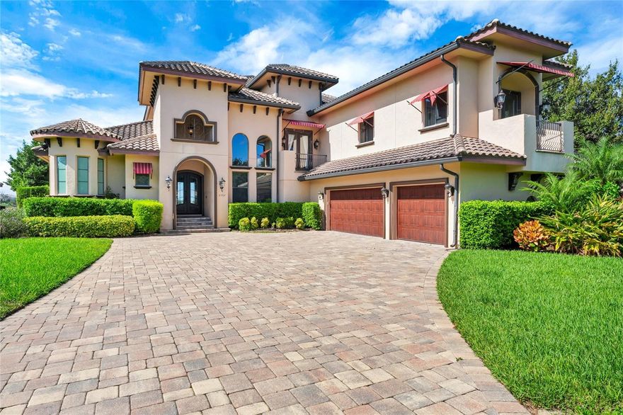 Stunning custom-built lakefront pool home on Lake Hancock offering luxury, comfort, and breathtaking views from nearly every room. Designed for entertaining, this remarkable residence features a chef’s dream kitchen with a wrap-around bar, center island, Bertazzoni 5-burner gas range, double ovens, walk-in pantry, granite countertops, stainless steel appliances, and a stylish tile backsplash. The open living and family rooms flow seamlessly to the spacious lanai through elegant French doors, complete with retractable screens and a built-in gas grill for effortless indoor-outdoor living. The luxurious downstairs primary suite boasts a custom tray ceiling, spa-inspired bath with dual vanities, walk-in shower, large soaking tub, and spacious walk-in closets, with direct access to the lanai and pool. Upstairs, a screened lanai accessible from the bedroom, den/office, and gallery provides stunning lake views. Relax in the heated pool and spa with outdoor shower, or follow the travertine walkway to the private boat dock equipped with electronic lifts for a boat and jet ski. Architectural details include high ceilings, custom crown molding, and elegant curved walls in the breakfast nook and primary bath. Set on 1.64 acres of professionally landscaped and fenced grounds, a portion extending into the lake, this home also enjoys access to the desirable Summerlake community with a resort-style clubhouse, pool, tennis courts, fitness center, park, dog park, and playground — the perfect blend of elegance, comfort, and Florida lakefront living.