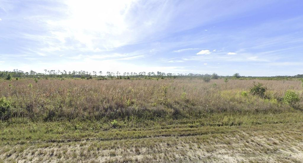 Photo of 507 Portulaca Drive, Indian Lake Estates, FL 33855 (MLS # TB8353006)