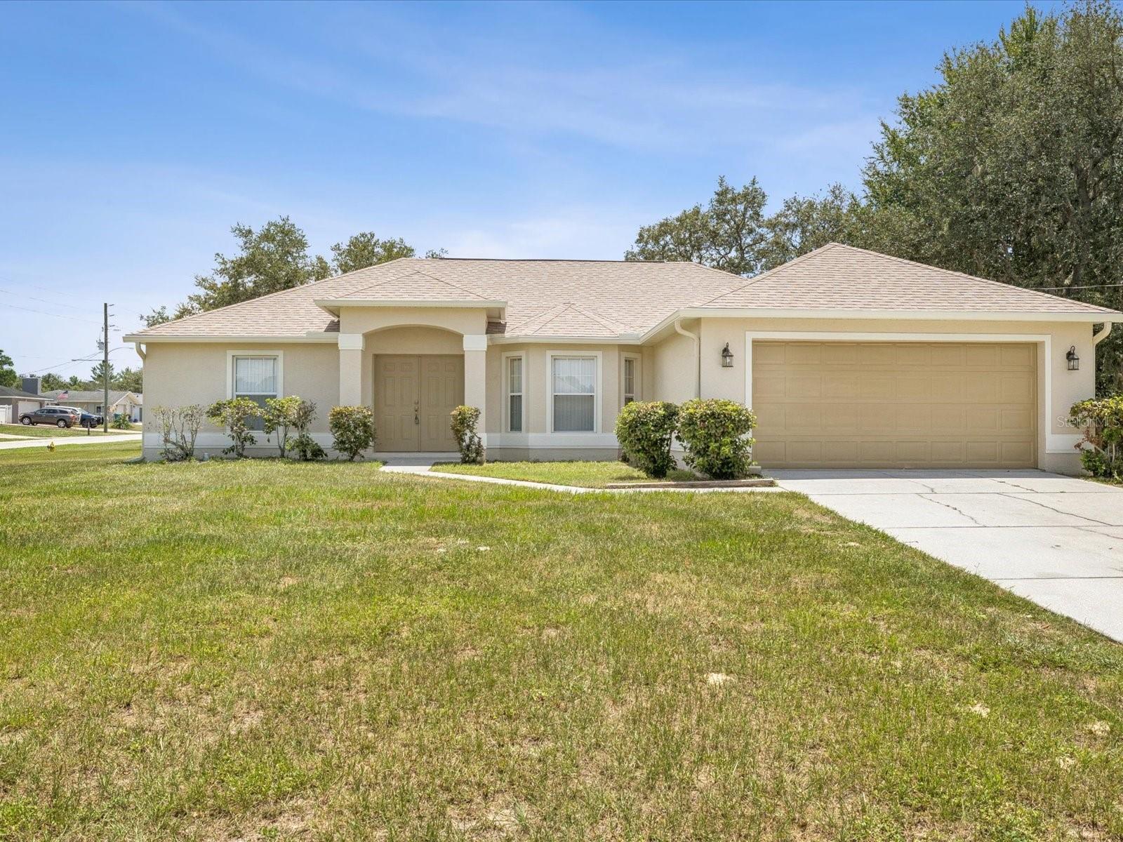 Step into this beautifully maintained 3-bedroom, 2-bathroom home located on a spacious corner lot! With brand new flooring throughout, fresh interior and exterior paint, and a brand new roof, and all new kitchen appliances, this home is move in ready! The eat-in kitchen is open to the living room while the dining room is separate providing a more formal space. The split bedroom floor plan offers privacy and functionality. Enjoy the convenience of the master en suite with two sinks, a shower and two large closets! Great location- close to restaurants, entertainment and shopping!