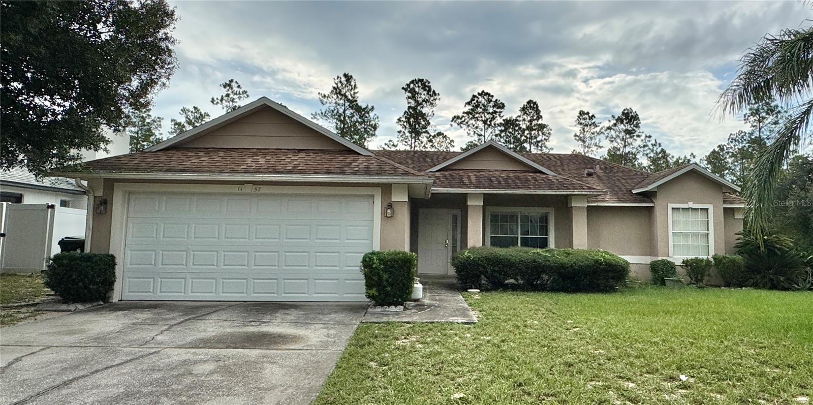 This spacious home features 3 bedrooms, 2 bathrooms, and a 2-car attached garage. Enjoy both a formal living room, dining room, and a comfortable family room perfect for entertaining or relaxing. The home offers a covered front porch and a screened-in back porch with no rear neighbors for extra privacy. Conveniently located near Kelly Park Springs, Rock Springs, shopping, and dining, this property combines comfort and location in one great package. This home is in the process of being painted and will be available soon!