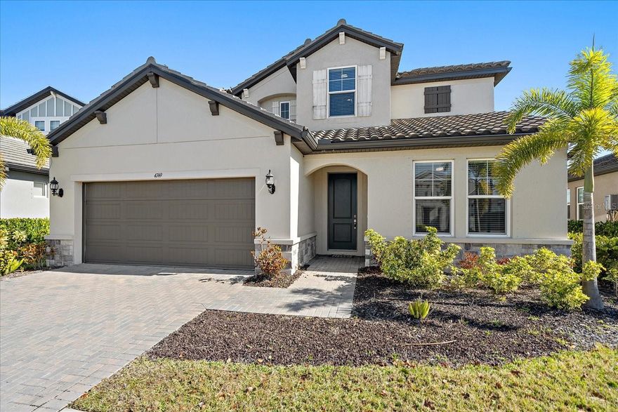 Just reduced, motivated seller. Welcome to this beautifully designed 2627 sqft home,built in 2022, offering 3 bedrooms, 3 bathrooms, an office/den with a thoughtfully planned layout, updated with crown molding, tray ceilings. The primary suite, second bedroom and an office/den are all conveniently located on the first floor, while one additional bedroom and a spacious great room,a bonus room provide ample space upstairs. This tile roof home featuring gourment kitchen with solid wood cabinets,  GE Profile appliances including a gas cooktop, wall oven, convection microwave, and refrigerator. An upgraded hood vented to the exterior, quartz counter tops, large kitchen island and pantry.Additional highlights include custom ceiling fans throughout, a custom stair handrail and spindles, upgraded carpet padding on the second floor. Located in the Worthington neighborhood which is very quite and peaceful, this gated community offers low HOA fees and NO CDD fees. This home is located two homes away to a scenic shell walking trail that winds around the community’s wetlands. Enjoy strolls, with a variety of bird species making their home in the area. Worthington boasts a desirable location, situated just 3 miles from the scenic Celery Fields, 6 miles from Waterside Place, 8 miles from University Town Center, 10 miles from downtown, and 14 miles from both Lido Key Beach and Siesta Key.