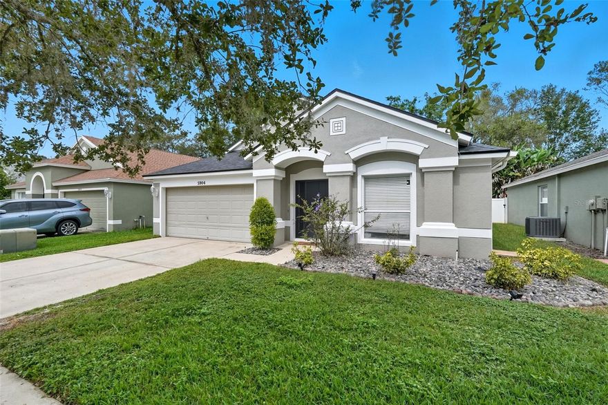 One or more photo(s) has been virtually staged. Beautifully Updated Home in Lexington Oaks — Golf Course Community Living at Its Best!

Welcome to 5904 War Admiral Dr., a beautifully updated 4-bedroom, 2-bath home perfectly situated on a peaceful conservation lot in the sought-after Lexington Oaks Golf and Country Club community.

Step inside to discover a spacious, well-designed layout featuring formal living and dining areas ideal for entertaining, plus a bright, open family room overlooking the private, fenced backyard. The renovated kitchen impresses with stone countertops, updated cabinetry, and a cozy dinette that flows seamlessly into the family room — perfect for everyday living and gatherings alike.

The primary suite offers a serene retreat with a huge walk-in closet and a beautifully upgraded en-suite bath showcasing a glass-enclosed shower, dual vanities, and a stunning sliding barn door that adds a touch of rustic elegance. Three additional bedrooms are thoughtfully positioned on the opposite side of the home, providing comfort and privacy for family or guests.

Enjoy quiet mornings or evening sunsets from your fenced backyard with tranquil conservation views and no rear neighbors.

Residents of Lexington Oaks enjoy resort-style amenities including a community pool, tennis courts, playgrounds, clubhouse, fitness center, and golf course, all with a low annual HOA of just $88. Conveniently located near I-75, top-rated Wesley Chapel schools, premium shopping, restaurants, and medical centers, this home offers both comfort and convenience.

Don’t miss your chance to own an updated home in one of Wesley Chapel’s most desirable communities — a perfect blend of value, lifestyle, and location!