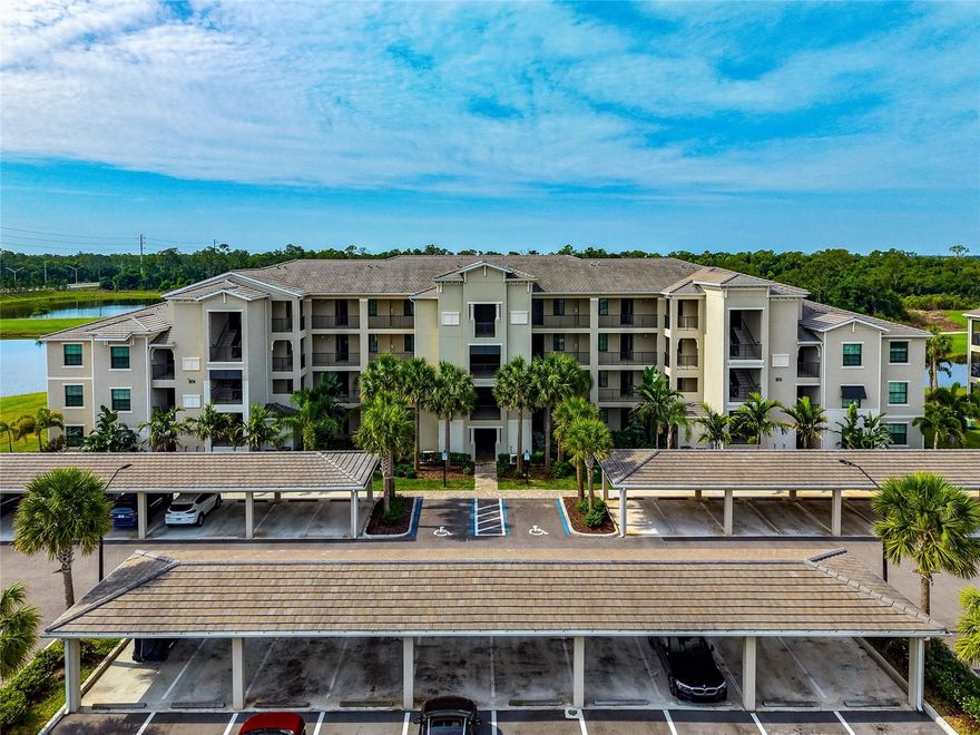 Positioned within the gated golf and country club community of Lakewood National Golf Club, this first-floor condo delivers the kind of lifestyle buyers come to Florida chasing. From championship golf and a resort-style pool to tennis, pickleball, fitness center, and the impressive clubhouse, the amenities here make it easy to see why Lakewood National continues to stand out in today’s market.

This ground-floor unit brings added convenience that owners and seasonal residents alike appreciate, with no elevators to deal with and a covered carport just steps from the front door. Inside, the open-concept floor plan feels bright and functional, with neutral tile flooring throughout the main living areas for a clean, low-maintenance finish. The kitchen is well appointed with quartz countertops, wood cabinetry, stainless steel appliances, and a breakfast bar that opens naturally into the living and dining spaces.

The primary suite offers a walk-in closet along with an en-suite bath featuring quartz countertops and a walk-in shower. Sliding glass doors lead out to the screened lanai, complete with an exterior screen door for direct outdoor access. The view is exactly what buyers are looking for in Lakewood National, with wide water and golf course views creating a setting that feels like a retreat whether you are enjoying your morning coffee or winding down at the end of the day.

If you have been waiting for an opportunity to enjoy the Florida golf and country club lifestyle without the maintenance of a larger home, this condo deserves a spot on your short list. Be sure to click the 3D virtual tour button for an interactive walk-through experience.