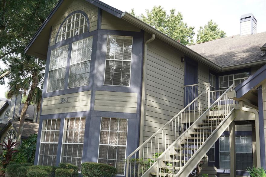 Welcome to this delightful 2-bedroom, 2-bathroom condo located in the Hidden Village community of Lake Mary. As you step inside, you'll find an inviting open floor plan that seamlessly connects the kitchen, living room, and dining area. The living room boasts a cozy wood-burning fireplace, soaring ceilings, and plenty of windows that fill the space with natural light. The dining area includes sliding glass doors that open to a private outdoor patio with extra storage space.The entire home is enhanced with laminate flooring. The community pool is just a few feet away from the unit.