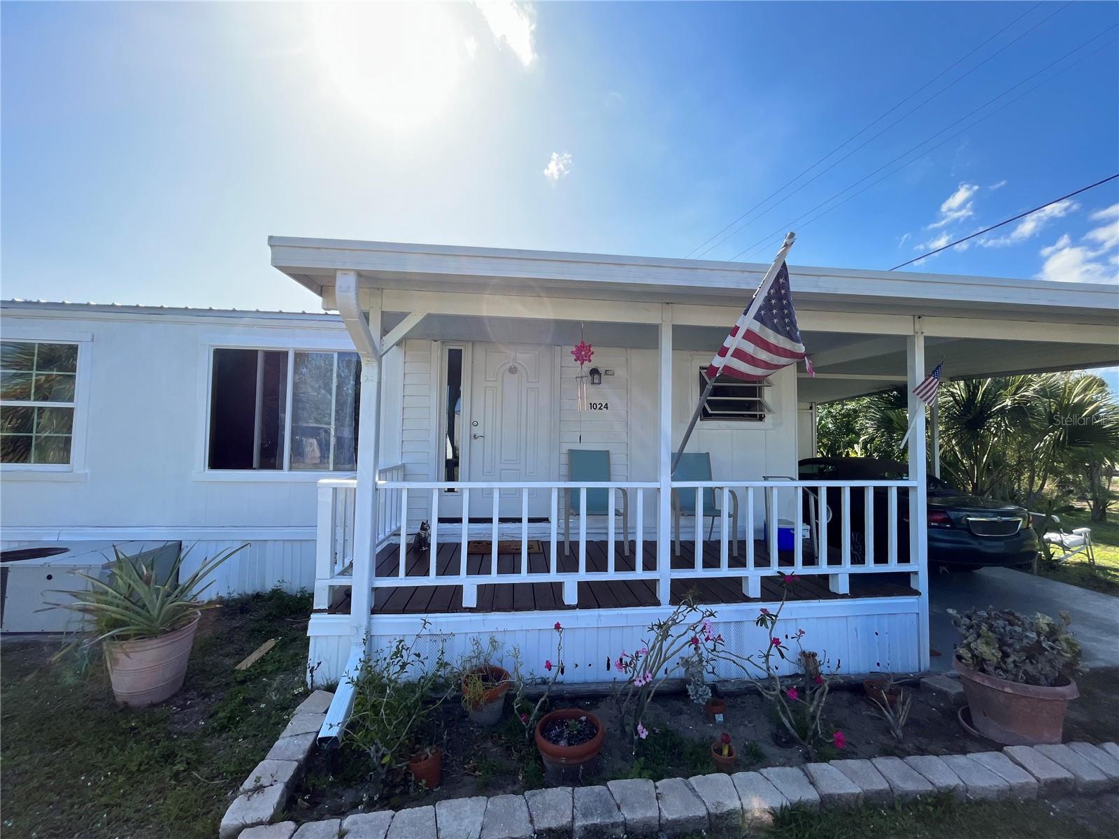 ~ LAKEPORT DELIGHT ~ For the avid fisherman! Spacious 3bd 2ba mobile home is perfect for entertaining or a seasonal rental. Large family living room, with shared dining area in the kitchen. This home boasts custom entryways, a bar and french doors throughout. 1142 under air and 2184 TLA. Sits on a double lot with a wood-working shop, and has a 2022 new metal roof. The outdoor patio is surrounded by tropical landscaping, the perfect place to relax and watch the sunset! This waterfront view also has a new large dock. Although this waterway does not give you access to Lake Okeechobee, you can fish the area canals, and the boat ramp is just minutes away. MAKE TIME TO CAST A LINE! All measurements are approximate.
