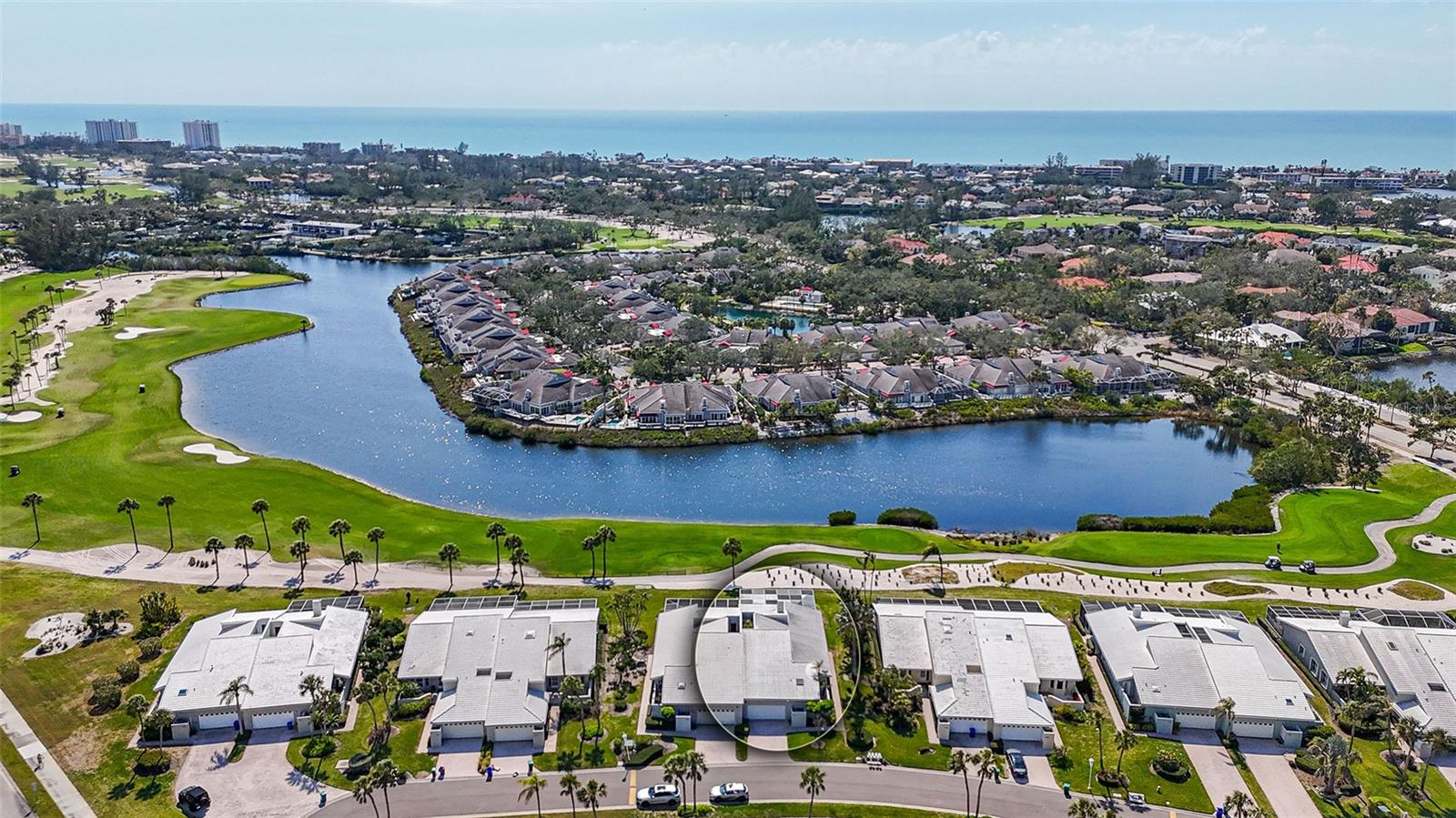 Revel in all the spaciousness and privacy – situated with wide water and golf views in the picturesque Corey’s Landing on Longboat Key. This maintenance free villa lives like a single-family home offering 3 bedrooms, 2.5 baths and a 2-car garage with private pool and spa. The main living area is both large and cozy, accentuated with a corner-set fireplace and a wall of sliders – filling the room with sunlight. The updated kitchen boasts granite counters, all-white cabinetry and appliances, an adjacent formal dining room and a breakfast bar adjoining the quaint eat-in space. The master suite is a delightful respite, with vaulted ceilings and master bath with spa tub, walk-in shower and dual vanities. Guest bedrooms are private with a connecting en-suite bath. Currently being used as a study is a third bedroom with a built-in closet and desk. Freshly painted interior (2025) and new carpet (2025) allow you to move right in! The expansive 2 story deck features a motorized awning, overlooking your private heated pool and spa. Known for its upscale amenities, Bay Isles residents in Corey’s Landing enjoy a laidback lifestyle with access to a pool and spa, tennis courts, 24-hour gated security, deeded beach access and a private beach club for residents. The prestigious Longboat Key Club has golf, marina and social memberships available and the St. Regis resort also has beach club offerings. Your opportunity is now!