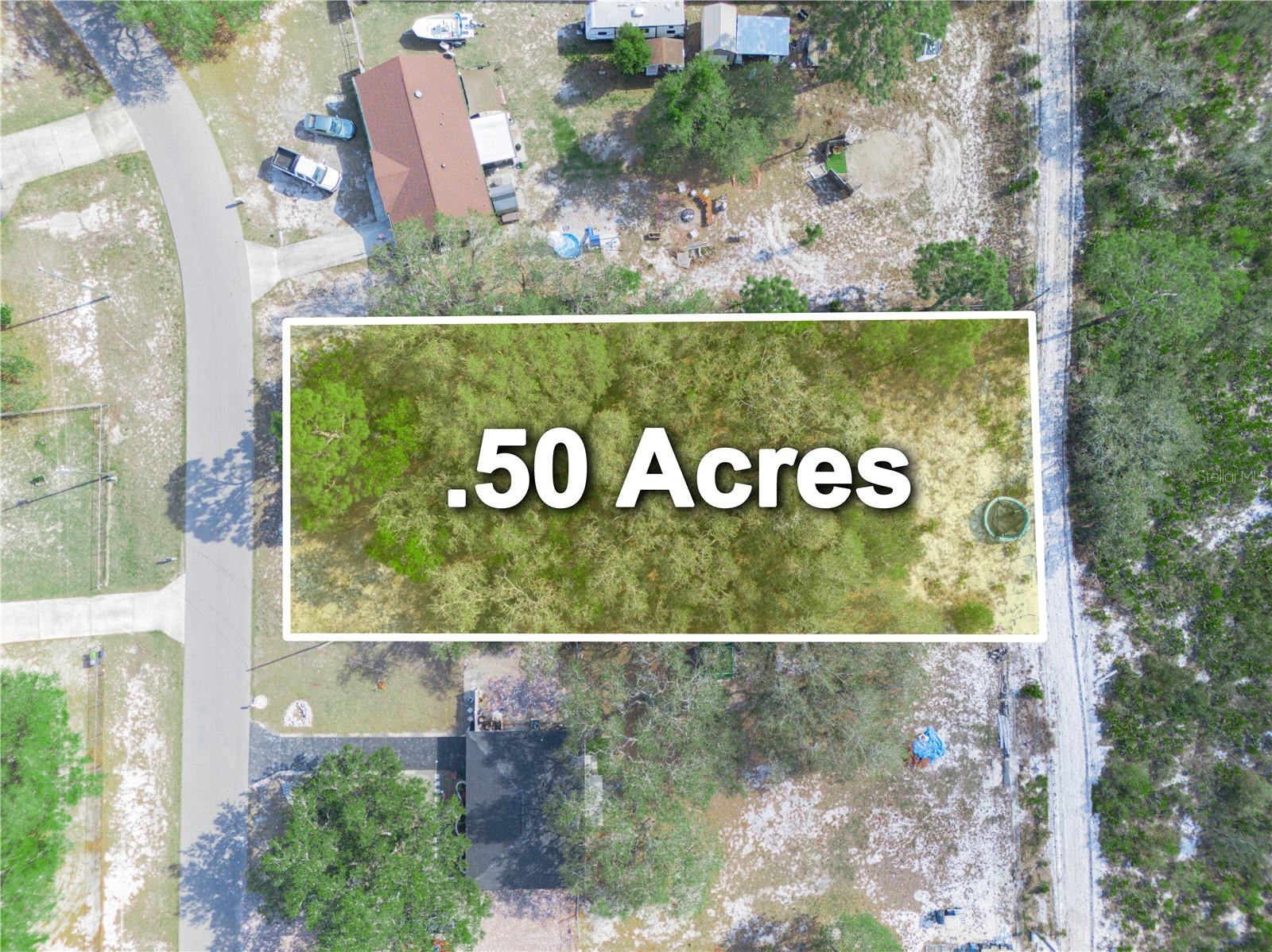 This is a 1/2 acre building lot East of Lake Wales, on a paved road. The POA is optional but Lake access is available if you join the optional POA, $55.00 annually for a vacant lot or $200.00 annually for residential. Membership provides access to the clubhouse, playground, pier, boat landing, basketball court and shuffleboard court.