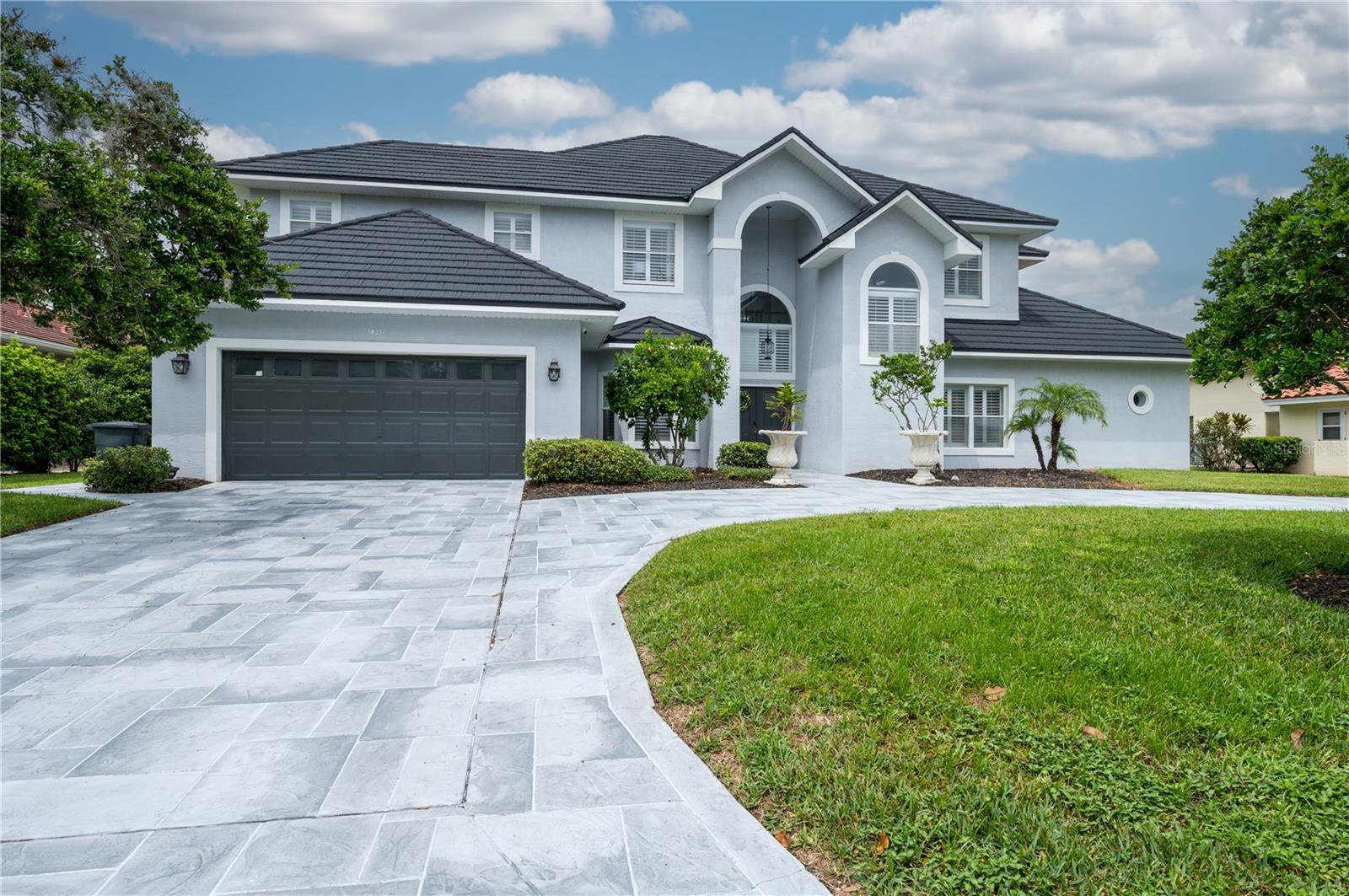 Welcome to Saddlebrook Resort Living! Discover the elegance of Florida resort-style living at the renowned Saddlebrook Resort. This stunning 5-bedroom, 4.5-bath estate boasts a brand-new roof (2024), new pool heater, high-efficiency water heater, and whole-house water Filter & Salt-free FutureSoft system—offering both peace of mind and modern comfort. Designed for sophistication and style, it’s the perfect retreat for family gatherings or grand celebrations alike. The heart of the home features a newly remodeled gourmet kitchen, thoughtfully designed with premium finishes and an open view of the oversized pool and picturesque golf course. The expansive great room and kitchen combination creates a seamless flow—ideal for hosting holiday dinners or entertaining friends in style. Step into the impressive 20-foot-high foyer and main living room, where soaring ceilings enhance the sense of space and grandeur. The formal dining room, fit for royalty, awaits your personal touch to make every occasion unforgettable. This thoughtfully designed two-story home boasts two en-suites on the main floor. Both with newly remodeled bathrooms and primary bedroom with an extra office/den/gym space awaits your creativity and vision to make it your own. An additional ensuite upstairs plus two spacious bedrooms, offering comfort and privacy for family or guests. From the moment you pass through the 24-hour manned gate, you’ll be welcomed by lush, mature landscape and breathtaking golf course views that set the tone for the lifestyle awaiting you. As a resident, you also can join the newly revitalized Saddlebrook Resort (with additional membership fees) and enjoy world-class amenities including pickleball & (grass, clay & hard) tennis courts, championship golf courses, resort-style pools, on-site restaurants, pro shop, and so much more. Near I-75, beaches, Orlando parks, hospitals, dining, shopping, and more to come…