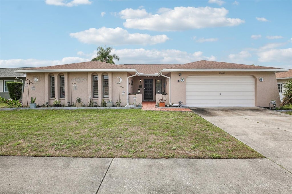 Photo of 12630 Cedar Ridge Drive, Hudson, FL 34669 (MLS # TB8544239)