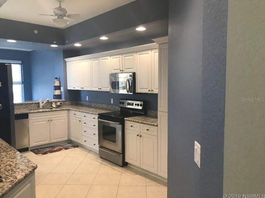 RESORT LIVING AT ITS VERY BEST.  OCEAN VIEW, BRIGHTLY LIT CORNER UNIT WITH MANY UPGRADES INCLUDING GRANITE COUNTER TOPS, TWO WALK IN CLOSETS AND WHIRLPOOL SPA TUB.  MINORCA IS THE FINEST OCEAN TO RIVER COMMUNITY IN NEW SMYRNA BEACH.  GATED 24 HOUR MANNED SECURITY, COMMUNITY HEATED SWIMMING POOL AND SPA, FITNESS CENTER, SAUNA, 4 LIGHTED HAR TRU TENNNIS COURTS WITH TENNIS PRO ON SITE, CERTIFIED YOGA CLASSES, OUTSTANDING CLUBHOUSE WITH POOL TABLE, LENDING LIBRARY, OCEANFRONT PAVILION AND RIVERFRONT GAZEBO WITH BBQ GRILLS, TABLE TENNIS, KAYAK STORAGE, MARINA WITH BOAT SLIPS AVAILABLE FOR PURCHASE.  ASSIGNED UNDERGROUND PARKING PLUS ADDITIONAL PARKING.