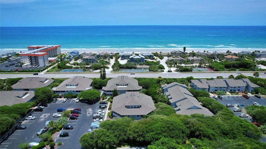 RARE, ground floor, fully furnished, 2/2 SEA WOODS VERANDA with bonus oversized WOOD DECK and screened patio.  Enjoy your day of serenity at the beautiful NO-DRIVE BEACH just across the street and return to the shade of your patio and/or deck surrounded by the natural beauty of Sea Woods canopied oaks.  You'll be hard pressed to find a condo beachside with this much outdoor space - let alone in a community as special as Sea Woods.  Inside you'll find some amazing upgrades including the granite kitchen counters and you'll absolutely love the elegant look and attention to detail displayed by the addition of the window, door & crown molding throughout.  Very tastefully furnished and well maintained, this condo definitely won't last long.  The Sea Woods community features 3 pools(1 heated), tennis courts, shuffleboard, pickleball, a large clubhouse, fitness center and winding streets and nature trails perfect for walking, jogging or biking surrounded by mature tropical landscaping.  There's truly no other community like this in New Smyrna Beach. ;LocationDescription: Condo ;Water: City