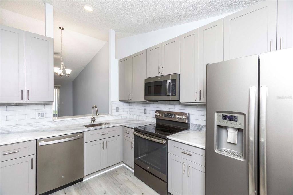 Photo of 327 Phlox Drive #327, Palm Harbor, FL 34684 (MLS # W7885784)