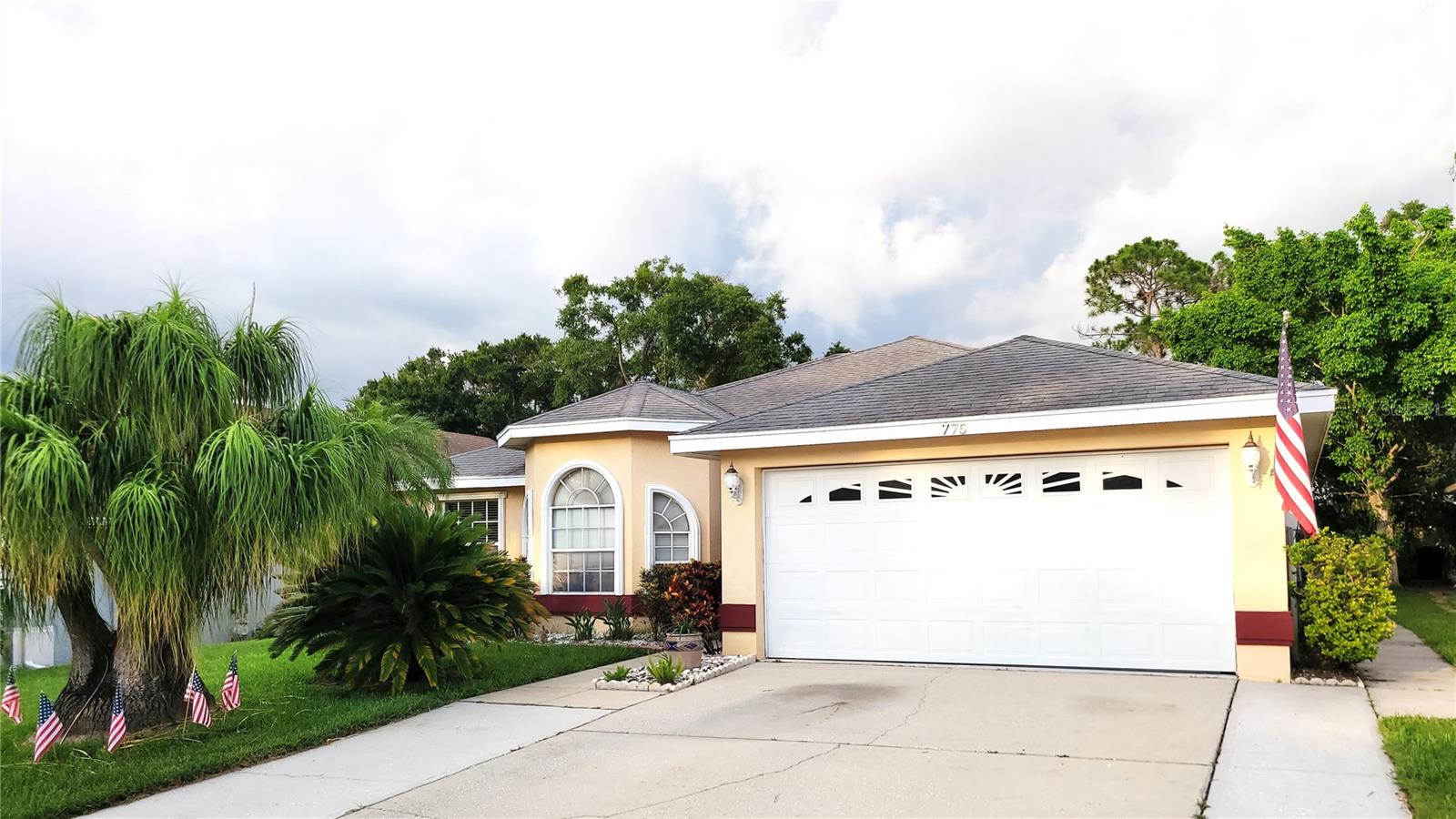 Welcome to your dream home in Harbor Hills of Palm Harbor, where comfort, style and convenience converge in a stunning 3-bedroom, 2-bathroom poolside retreat. Nestled in a charming neighborhood zoned with top-rated schools, this thoughtfully designed home offers the perfect blend of elegance and functionality. Step inside to a warm welcome from the formal dining and living rooms, where natural light pours in, highlighting a sparkling view of the private pool. The heart of the home is the open-concept kitchen, featuring sleek stainless-steel appliances, including a 2023 refrigerator, and ample cabinetry. Perfect for both everyday meals and entertaining, the kitchen seamlessly connects to the cozy family room, where sliding doors open to a spacious lanai, creating effortless indoor-outdoor living. A charming breakfast nook with matching cabinetry adds extra storage and style. Designed with gatherings in mind, this home shines! The expansive master suite, privately tucked away, boasts a generous walk-in closet and a luxurious en-suite bathroom with dual sinks, a walk-in shower, and a walk-in closet. On the opposite side, two well-appointed guest bedrooms share a beautifully updated bathroom with a tub-shower combo. Outside, the screened pool deck and extended covered lanai invite relaxation, while fire pit sets the stage for memorable evenings under the stars. Updated landscaping and mature shade palms create a cool, inviting fenced yard, perfect for enjoying Florida’s sunny days. This home is loaded with upgrades: vaulted ceilings, plantation shutters, a 2020 HVAC system, a 2015 pool pump and filter, a 2023 microwave and a washer and dryer that convey with the sale. The original shingle roof and 2010 pool gas heater ensure lasting value. Located in Flood Zone X ( FEMA’s current flood map) and a non-evacuation zone ( Pinellas County), this home offers peace of mind. (elevation of 56 feet-Never flood)Perfectly situated, you’re just minutes from the vibrant Sponge Docks in Tarpon Springs, Honeymoon Island Beach, and the charming downtowns of Palm Harbor, Dunedin, and Tarpon Springs, brimming with dining, shopping, and entertainment. Outdoor lovers will enjoy nearby parks, the Pinellas Trail, and pristine beaches, while commuters will appreciate 30 minutes access to Tampa International Airport and Clearwater Beach. Embrace the relaxed Florida lifestyle with all the modern comforts—this Harbor Hills gem is ready to welcome you home!