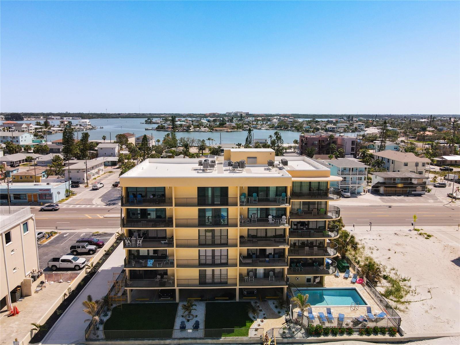 ***FRACTIONAL OWNERSHIP*** Owner is selling 50% ownership. ----> https://vimeo.com/1085300282/4f745b19b3 <---- Own a million-dollar oceanfront home for half the price! Use it as a second home or plug right into the earnings from guest bookings. EXCELLENT INVESTMENT OPPORTUNITY **CHECK OUT THE 360 VIRTUAL TOUR AND ONLINE VIDEO** Want to own a majestic piece of paradise in one of Florida's most sought-after areas? Come visit and you'll want to stay! Welcome to your stunning condominium located on the picturesque sands of Madeira Beach, where coastal living meets modern luxury. This FULLY RENOVATED, TURN-KEY 2-bedroom, 2-bathroom condominium in the vibrant Trillium Condo community spans an impressive 1,415 square feet with THREE BALCONIES, one that wraps around the rear overlooking the ocean and private balconies off each bedroom! Step inside to discover an elegant interior, upgraded extensively with NEW PLUMBING, HVAC SYSTEM, WINDOWS AND SLIDERS, WASHER/DRYER AND NEW ELECTRICAL with and updated PANEL. Talk about WORRY FREE OWNERSHIP for years to come! The kitchen is any CHEF'S DREAM featuring UPGRADED STAINLESS-STEEL APPLIANCES, LUXURY DESIGNER CABINETS that supplies plenty of storage space, topped with GRANITE COUNTERTOPS and a thoughtfully re-designed kitchen layout. The custom built, OVERSIZED KITCHEN ISLAND is perfect for entertaining friends and family with ease. All new flooring throughout and with NO CARPET, making beach cleanup a breeze! You'll find this unit has been THOUGHTFULLY DECORATED, FRESHLY PAINTED, meticulously designed with elegance and comfort in mind. Enjoy the look and feel of all newer, modern fixtures, decorations and furniture throughout. Open your sliding doors, that span the entire outside of the unit- to embrace the coastal breezes that glide through the home. Enjoy the benefits of a well-managed community, with MANY exciting building improvements such as BRAND-NEW POOL RESURFACING 4/2025, NEW ROOF 2/2024, STUCCO MESMERIZED 4/2025, NEW FENCING 4/2025, PARKING LOT 1/2025, LANDSCAPING, 2/2025, ELEVATOR REPLACED 5/2025, NEWER DECKS AND RAILS and UPDATED POOL BATHROOMS 3/2025. This property is not just a home; it is a lavish lifestyle waiting to be embraced. Claim your piece of the Florida coastline today! Contact your Realtor today for a private showing OR request more information.