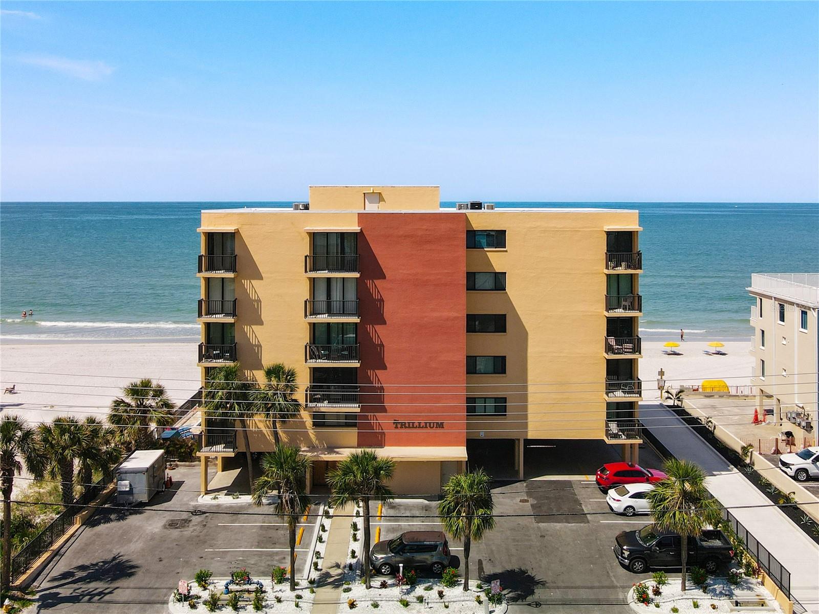 ***FRACTIONAL OWNERSHIP*** Owner is selling 50% ownership. ----> https://vimeo.com/1085300282/4f745b19b3 <---- Own a million-dollar oceanfront home for half the price! Use it as a second home or plug right into the earnings from guest bookings. EXCELLENT INVESTMENT OPPORTUNITY **CHECK OUT THE 360 VIRTUAL TOUR AND ONLINE VIDEO** Want to own a majestic piece of paradise in one of Florida's most sought-after areas? Come visit and you'll want to stay! Welcome to your stunning condominium located on the picturesque sands of Madeira Beach, where coastal living meets modern luxury. This FULLY RENOVATED, TURN-KEY 2-bedroom, 2-bathroom condominium in the vibrant Trillium Condo community spans an impressive 1,415 square feet with THREE BALCONIES, one that wraps around the rear overlooking the ocean and private balconies off each bedroom! Step inside to discover an elegant interior, upgraded extensively with NEW PLUMBING, HVAC SYSTEM, WINDOWS AND SLIDERS, WASHER/DRYER AND NEW ELECTRICAL with and updated PANEL. Talk about WORRY FREE OWNERSHIP for years to come! The kitchen is any CHEF'S DREAM featuring UPGRADED STAINLESS-STEEL APPLIANCES, LUXURY DESIGNER CABINETS that supplies plenty of storage space, topped with GRANITE COUNTERTOPS and a thoughtfully re-designed kitchen layout. The custom built, OVERSIZED KITCHEN ISLAND is perfect for entertaining friends and family with ease. All new flooring throughout and with NO CARPET, making beach cleanup a breeze! You'll find this unit has been THOUGHTFULLY DECORATED, FRESHLY PAINTED, meticulously designed with elegance and comfort in mind. Enjoy the look and feel of all newer, modern fixtures, decorations and furniture throughout. Open your sliding doors, that span the entire outside of the unit- to embrace the coastal breezes that glide through the home. Enjoy the benefits of a well-managed community, with MANY exciting building improvements such as BRAND-NEW POOL RESURFACING 4/2025, NEW ROOF 2/2024, STUCCO MESMERIZED 4/2025, NEW FENCING 4/2025, PARKING LOT 1/2025, LANDSCAPING, 2/2025, ELEVATOR REPLACED 5/2025, NEWER DECKS AND RAILS and UPDATED POOL BATHROOMS 3/2025. This property is not just a home; it is a lavish lifestyle waiting to be embraced. Claim your piece of the Florida coastline today! Contact your Realtor today for a private showing OR request more information.