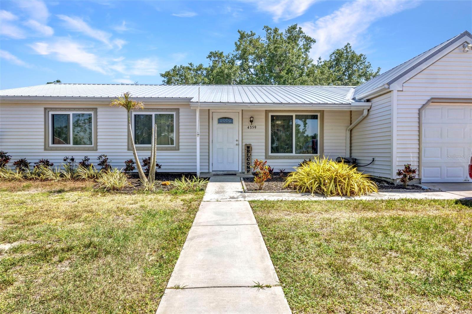 Fall in love at first sight with this meticulously maintained 3-bedroom, 2-bathroom home that has everything you desire.
Featuring a newer metal roof, hurricane impact windows, and a 2022 AC unit, this home ensures longevity for your investment. The expansive primary bedroom, measuring 319 sq ft, is perfect for a parents' retreat, hobby area, or office space. Enjoy the elegance of matching ceramic tile throughout the home.
The large 12 x 4.5 ft pantry is a significant plus! Off the kitchen, a set of sliders leads to an 11 x 13 bonus space, currently used for entertainment but ideal for a peaceful office, blocking outside distractions. Another great seating area is the spacious 12 x 24 Family Room. Adjacent to the Family Room is the 12 x 24 ft lanai, which opens to the fenced-in backyard with shade trees and a fire pit.
If you love entertaining or have a big family, this is the place for you. Flood insurance is not required, and the home is connected to city water and sewer. Located less than a mile from Coco Plum shopping on 41, close to I-75, and just under 30 minutes from Gulf Beaches, MLB Spring training facilities, world-class golf, fishing, boating, parks, and dining, this home is in a highly desired location.