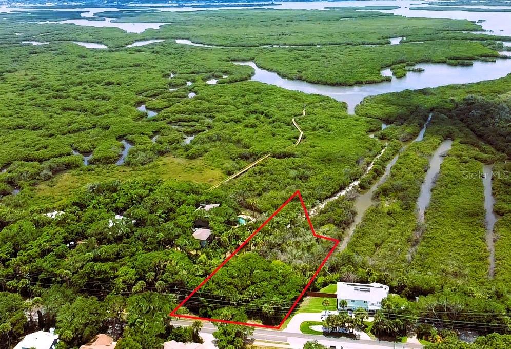 Photo of 4168 Saxon Drive, New Smyrna Beach, FL 32169 (MLS # NS1088387)