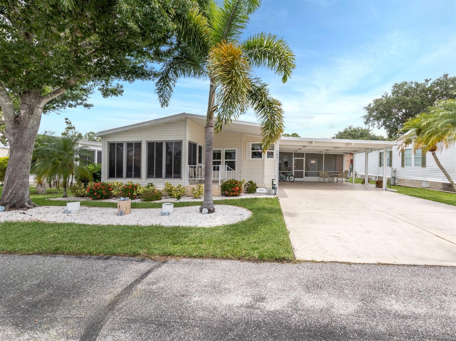 Welcome to this charming two-bedroom, two-bathroom manufactured home in the boutique, pet-friendly community of Village at Riverwalk in North Port, Florida. Spanning 1,496 square feet, this home offers plenty of room to stretch out and relax. Enjoy three outdoor spaces, including a Florida room, a bonus Florida room, and a screened-in porch at the front of the home. Inside, you'll find sheetrock walls, updated windows, vaulted ceilings, and laminate floors throughout the living spaces and bedrooms. The kitchen boasts newer appliances and a cozy eat-in space perfect for morning coffee. The guest room features a Murphy bed, making it ideal for visitors, while the primary bedroom includes a large ensuite bathroom with an oversized vanity and a spacious walk-in closet. Natural light floods the home, creating a warm and inviting atmosphere.
Living in Village at Riverwalk offers a variety of activities and amenities to enhance your lifestyle. Take advantage of the beautiful walking trails, perfect for morning strolls or evening walks. Enjoy the kayak launch for adventurous outings on the water and admire the mature landscaping that adds to the community's charm. Whether you're looking for relaxation or recreation, Village at Riverwalk provides the perfect setting for a vibrant and fulfilling life.