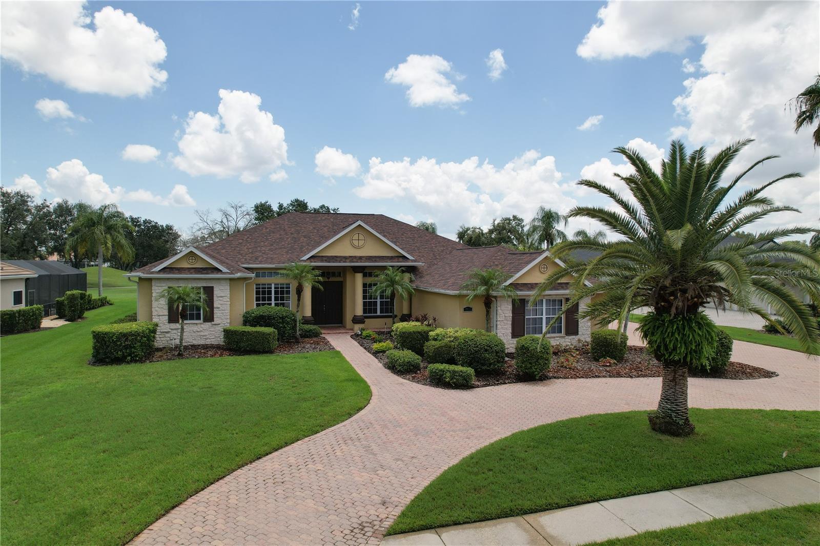 One or more photo(s) has been virtually staged. Breathtaking view of the 13th tee on the semi-private River Club Golf Course! This large floor plan layout is perfect for entertaining and situated on one floor! Featuring the primary bedroom with en suite on one side of the home with sliders to the screened lanai and private heated pool. The den is positioned off the formal living room and close to the primary bedroom. Three additional bedrooms with 2 additional baths are positioned on the other side of the home. The large kitchen with butler’s pantry has a breakfast bar and dinette area overlooking the pool. The wood glazed cabinetry is plentiful with room for all your kitchen gadgets too! Ceramic tile and engineered wood flooring throughout the living areas and brand-new carpet being installed in all the bedrooms (virtual images of the bedrooms included as all the carpet has been removed). Two covered lanais and the oversized screened patio and pool provide plenty of outdoor entertaining space. Side load 3-car garage and the circular drive provides plenty of space for you and your guests. Home has been professionally cleaned including steam cleaning both the tile and grout. New carpet expected by mid-August. Close to all the wonderful amenities in Lakewood Ranch!