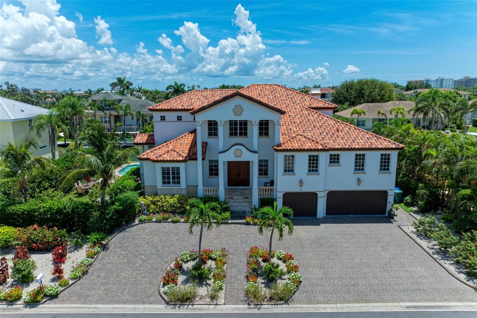 NEW PRICE — Waterfront Luxury on Longboat Key!
Welcome to 550 Yardarm Lane, where the elegance of Longboat Key meets the ease of Florida’s coastal lifestyle — in the coveted Country Club Shores. This waterfront, ELEVATED masterpiece isn’t just a home — it’s your front-row seat to paradise, where boating, beach walks, and year-round sunshine are part of everyday life.
Step inside and be instantly captivated by sparkling water views, soaring spaces, and the perfect blend of casual comfort and refined luxury. Designed for both relaxation and unforgettable entertaining, this 5-bedroom, 5.5-bath retreat is tailor-made for hosting family and friends in style.
PRIME WATERFRONT LIVING — Private dock on a deep-water canal with no-bridge access to the bay — perfect for your weekend cruiser.
LIGHT & BRIGHT OPEN LAYOUT — Walls of glass bring the outdoors in, filling the home with sunshine and stunning water views.
ELEVATOR — Effortless access to main living levels from the three car garage.
CHEF’S DREAM KITCHEN — High-end appliances, custom cabinetry, and an oversized island ready for gourmet meals and lively gatherings.
LUXURIOUS SUITES — Owner’s retreat with a private balcony, spa-inspired bath, and dual walk-in closets.
MOVIE ROOM — Your own private theater for cozy nights in.
OUTDOOR OASIS — infinity pool, spacious patio, and lush landscaping for poolside lounging or sunset soirees.
All this just steps to your DEEDED BEACH ACCESS and minutes from the world-class dining, shopping, and cultural treasures of St. Armands Circle and Downtown Sarasota.
Whether you’re dreaming of a full-time Florida home or a seasonal escape, 550 Yardarm Lane delivers the ultimate Longboat Key lifestyle.