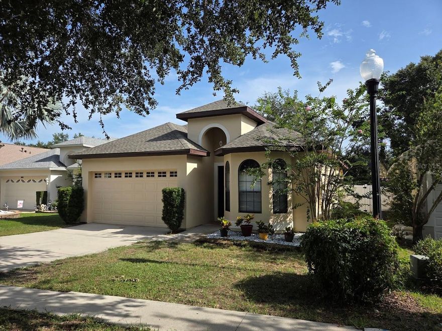 Welcome home to this beautiful 3-bedroom, 2-bath home that is in a quiet cul-de-sac within a gated Leesburg community.  The home lives large with nearly 1500 square feet, offering a great floor plan and features a split bedroom layout with a spacious master suite complete with a soaking tub, walk-in shower, dual sinks and walk-in closet.  The home has tall ceilings and doors.  The Kitchen has an abundance of Corian counters with high end stainless appliances. The home is in a sought-after gated community with a low HOA fee which includes a Community Pool and Playground. Major updates include new sprinkler heads and irrigation maintenance (2026) screened porch (2025), stainless high end kitchen appliances (2025), tile flooring (2025), AC (2024), Roof (2022). Enjoy sitting in your newly screened porch and totally fenced back yard. This home is in a prime location that is close to Hospitals, Doctors, Shopping, and Dining and is Move in Ready. Owners Can Close Quickly.  Schedule today and discover all the many reasons you should live here.
