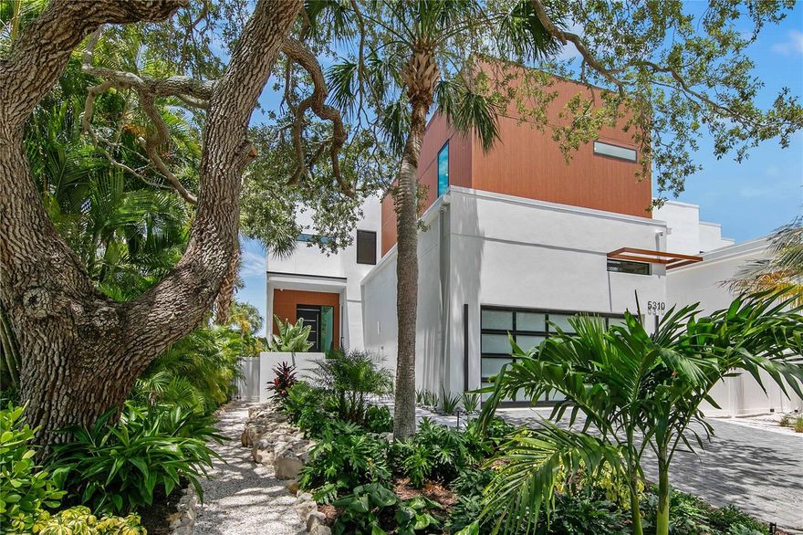 Sophisticated and sleek, a dazzling new construction home located in the heart of Siesta Key. A modern exterior will inspire neighbors and onlookers with its modern elevation. A courtyard provides a private entrance for you to welcome guests into the two-story foyer illuminated by an intriguing chandelier. An adjacent study features sliding, pocket doors that can be open to create a more vast entryway or closed for privacy. The kitchen is truly the heart of the home with refined cabinetry, handsome hardware, paneled appliances and pristine quartz countertops that shimmer under fashionable light fixtures. Display gorgeous glassware and invent an impressive aperitif from your refined bar area with glass-front cabinetry, floating shelves with accent lighting and a convenient bar sink. The exciting details continue to astonish in the great room featuring soaring ceilings, innovative design details and a chandelier that finishes the elegant ambience. The best of the Florida lifestyle can be yours with seamless indoor and outdoor integration through disappearing sliders leading to your outdoor entertainment space. Grill and dine in comfort in your covered lanai with an outdoor kitchen and pool bath, soak up the sun poolside in loungers or refresh by taking a dip in the pool with a spa. Rinse the day’s adventures away in your outdoor shower before heading inside to relax and recharge. This home offers two principal suites with equally impressive en-suite bathrooms - one on the first level with private access to the patio and the second is on the upper level. The second floor boasts a flexible loft area and two additional bedrooms each with a private bath. Catch stunning views from sunrise to sunset as you ascend the circular staircase to your rooftop terrace, the perfect perch to view Siesta Key’s Grand Canal, a 10-mile long network of shallow canals that are the playground for wading birds, manatees, and dolphins and empties into Roberts Bay.  This is Florida outdoor living at its finest:  just a 10-minute walk to the world-renowned Siesta Key Beach or enjoy any number of water sports with your customized private boat dock.   State of the art design and excellence in construction, TDI Coastal Homes builds luxury homes that exceed expectations and meet your wildest lifestyle needs.