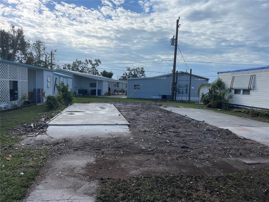 ****Motivated Seller*****Mobile home was removed because of damage from hurricane Ian. This lot is ready for a brand new home. The electric, water and sewer are still there for the new owner to hook up to. This is a very active community with plenty of things to do. Oak Grove is a 55 and over community and offers many amenities for residents, including: Heated Pool, Free Wi-Fi, Laundry Facilities, Recreation Hall, Shuffleboard Courts, Dog Walking Area, Picnic Tables, Butterfly Garden & Benches, Scheduled Community Events, Old Florida-style Grounds & Landscaping, Activities on the Greens (Lawn-Bocce, Corn Hole Toss, Croquet, Putting Green).  Located just minutes to the beach, dining, shopping and medical facilities.