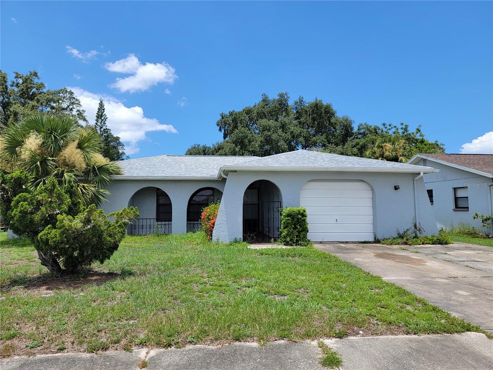 Cozy rental home in Holiday, Florida, available Sept. 15th. 2025. 2 BR/ 2 BA/ 1 GA home centrally located with nearby shopping, dining, and major roadways for convenient commutes. The kitchen features a breakfast bar that overlooks and connects with the family room. Enjoy easy maintenance tile flooring in the kitchen and beautiful vinyl flooring in the family room and both bedrooms. The primary bedroom suite boasts a walk-in closet and en-suite bathroom. The spacious enclosed back porch and fenced back yard are perfect for relaxing and enjoying the year-round Florida weather. Call to schedule your showing today!