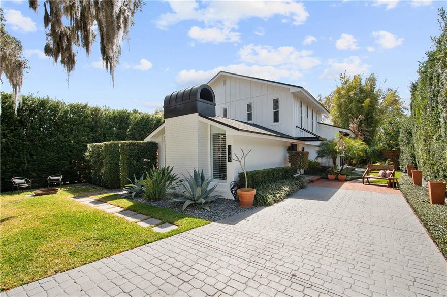 Welcome to 1760 Alabama Drive, an architectural standout in Winter Park’s coveted Golden Triangle, known locally as The Vias. Positioned just houses away from some of the most valuable real estate in 32789 and steps from Kraft Azalea Park, this 2,841 sqft mid-century residence sits in one of Winter Park’s most exclusive and tightly held enclaves. Lakefront sunsets, shaded walking paths, and the serenity of the Chain of Lakes lifestyle are at your doorstep with a respected local racquet club just minutes away for those who value both community and an active lifestyle. This is authentic mid-century architecture, thoughtfully modernized without compromising its soul. Clean lines. Intentional geometry. Expansive walls of glass. Natural light floods nearly every room through oversized windows, while dramatic 20 foot hedges on both sides create an extraordinary sense of privacy. You experience openness without exposure a rare and highly desirable balance. At the heart of the home is a true chef’s kitchen featuring completely custom cabinetry and restaurant quality appliances. This is a serious culinary space built for performance and designed with craftsmanship in mind. It flows seamlessly into the main living areas, supporting both elevated entertaining and everyday living. The home offers (4) four bedrooms and (2.5) two and a half baths, including an impressively scaled primary suite that feels like a private retreat. A massive great room anchored by a functional fireplace provides architectural presence and flexibility currently styled as a study or office, but equally suited as a dramatic living space. Step outside and the lifestyle expands. The backyard is designed for gathering, centered around a fully realized outdoor gourmet kitchen and expansive entertaining area made for long evenings and effortless hosting. There remains generous room for a future pool without compromising the integrity of the space, a rare blend of finished outdoor luxury and future optionality in this neighborhood. A private rear driveway and (2) two-car garage add convenience and discretion rarely found in this pocket of Winter Park. In this market, location drives value. This address is not just a location, it’s a strategic position. Architectural distinction, immediate park access, privacy, and proximity to the very best of Winter Park define its enduring appeal.