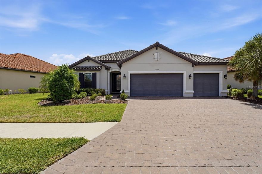 Set behind a private preserve view with no rear neighbors, this extensively upgraded residence in the gated, maintenance-free community of Esplanade at Artisan Lakes offers 3 bedrooms, 3 bathrooms, and a spacious den/bonus room ideal for a home office, media room, or additional guest space. Designed for both everyday comfort and elevated entertaining, the home showcases nearly 2,400 square feet of thoughtfully curated living space, highlighted by high-end builder upgrades, expansive gathering areas, and an extended screened lanai overlooking lush greenery and mature trees.

Inside, the desirable split floor plan is enhanced by tray ceilings, crown molding, 8-foot interior doors, upgraded tile flooring throughout the main living areas, and abundant natural light. The chef’s kitchen serves as the centerpiece of the home, appointed with GE Café built-in appliances including wall ovens, cooktop, hood, and dishwasher, along with Level 7 cabinetry, soft-close drawers, upgraded quartz countertops, decorative cabinetry details, under-cabinet LED lighting, and an oversized island designed for entertaining. The open gathering room and casual dining extension create seamless flow throughout the living spaces, while the covered lanai with outdoor kitchen rough-in provides the perfect setting for year-round indoor-outdoor living.

The owner’s suite offers a luxurious private retreat featuring a bay window extension, tray ceiling, oversized customized closet space, and an upgraded spa-inspired bath with frameless glass shower enclosure and designer finishes. Additional highlights include a 3-car garage with sealed flooring, tankless gas water heater, whole-home technology package, upgraded storage systems throughout, and extensive builder-selected enhancements rarely found in resale homes.

Residents of Esplanade at Artisan Lakes enjoy access to multiple amenity centers featuring resort-style pools and spas, pickleball and tennis courts, fitness facilities, clubhouse spaces, walking trails, and a full calendar of social activities, all within a beautifully maintained, gated community conveniently located near Lakewood Ranch, Sarasota, St. Petersburg, and Tampa.