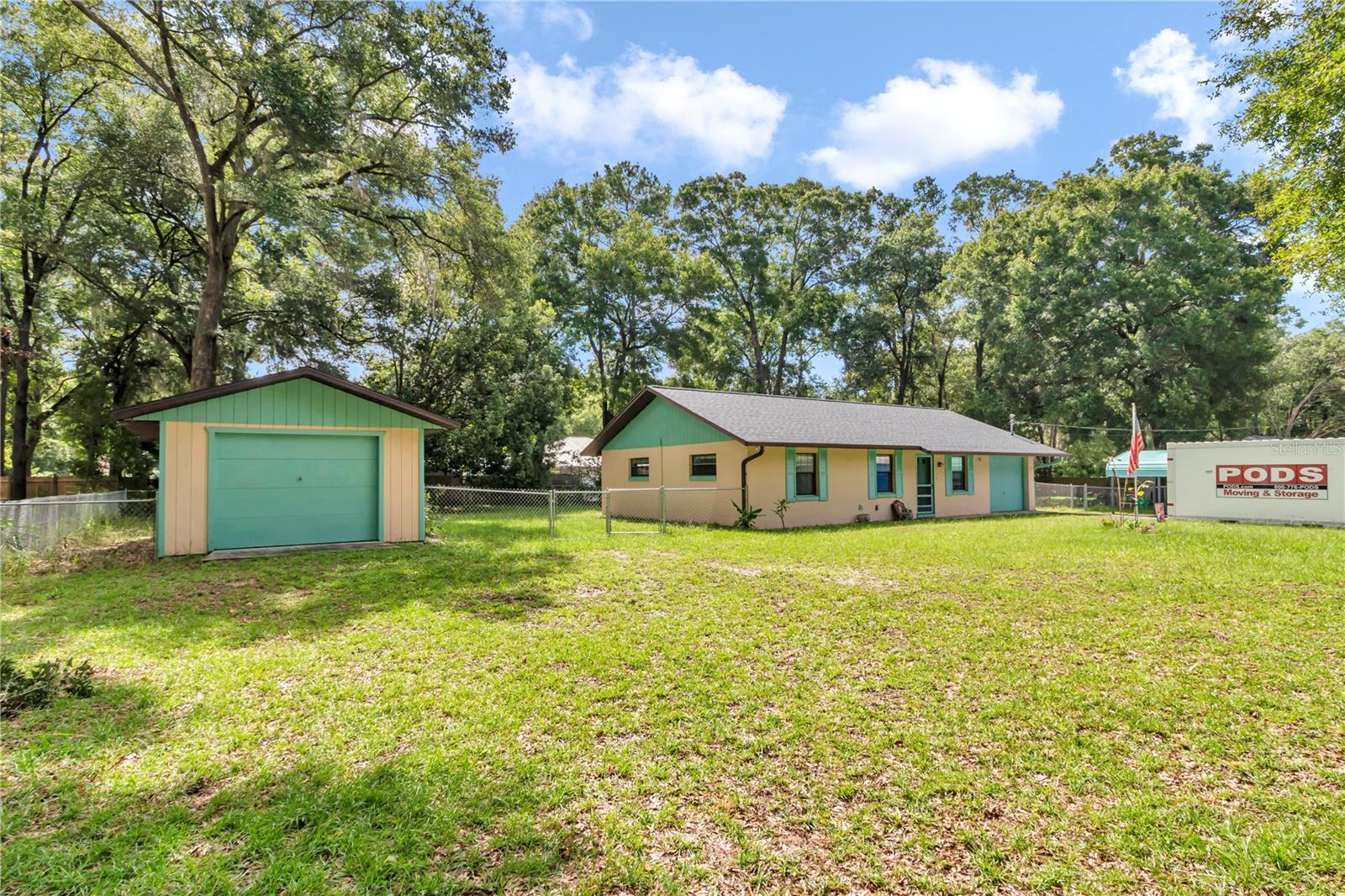 NO HOA, .46 of an acre double lot, fenced in with detached one car garage/workshop, storage shed, two car carport and above ground pool. This charming home concrete block home has new luxury vinyl paint floors, 2025 30 year architectural roof, the HVAC is 2022, hot water heater 2022, 2025 interior and exterior paint. This three bedroom two bath plan features walk-in shower in the primary bath, spacious living room, leading to dining in kitchen and inside laundry room. Step outside of your sliding glass door into your cupboard and enclose lanai overlooking the new above ground pool and fenced backyard! Attached to the home is a one car garage as well that could easily be converted for additional square footage. Rain, gutters. On septic and well.All within five minutes of the world equestrian center!