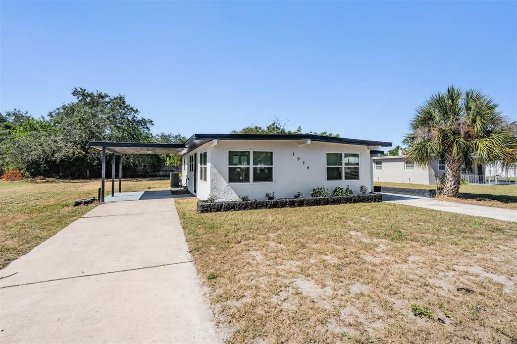 Photo of 1819 Grand Boulevard, Holiday, FL 34690 (MLS # TB8440060)