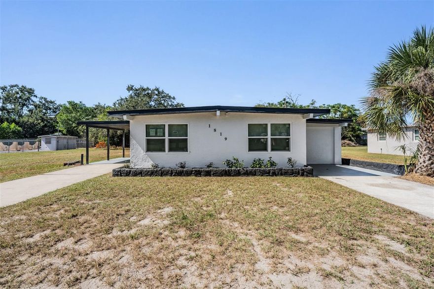 Welcome to this tastefully updated home in Holiday FL! The home itself sits on a large lot with a huge backyard, and features 3 spacious bedrooms and plenty of living space. As you approach the home, you have your option of 2 driveways and entrances - along with your choice of living areas! The fresh kitchen has been updated with white shaker cabinetry, stainless steel appliances, and quartz countertops. Throughout the home you'll find luxury vinyl flooring, offering a bright and clean color scheme. All 3 bedrooms are of good size, with one clearly the biggest as the primary. The central bathroom is light and bright. Some of the major recent updates to the home include all new windows, new roof, new HVAC, new appliances, kitchen, bathroom, flooring, paint and much more! Don't miss this opportunity to own a great,  freshly renovated house!