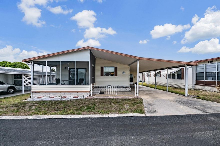Want a winter retreat or full-time Florida home? Discover this exceptional property in the desirable Spanish Trails 55+ community where you own the land — no lot rent! Ideally located in the heart of the community, this beautifully maintained FULLY FURNISHED, 2-bedroom, 2-bath double-wide offers comfort, style, and an inviting open-concept layout, all with a low HOA fee of just $114 each month. Even better, this home and community are now VA loan approved, offering additional financing opportunities for qualified buyers. Step inside and enjoy the bright, spacious floor plan featuring updated laminate flooring, a beautifully designed kitchen, and an open dining and living area that creates the perfect space for entertaining or relaxing. The kitchen offers attractive appliances, ample cabinetry, and a seamless flow into the main living spaces, giving the home a warm and welcoming “great room” feel. The spacious primary suite features a large walk-in closet and an updated en-suite bath with a convenient step-in shower. The second bedroom is bright and comfortable with generous storage and a ceiling fan for added comfort. This move-in-ready home also includes a membrane roof installed in 2013, newer A/C system, newer hot water heater, laundry area off the carport with washer and dryer included, a screened-in patio perfect for enjoying the Florida sunshine, and an additional covered outdoor patio area for relaxing or entertaining guests. Residents enjoy access to outstanding community amenities including a heated pool, spa, clubhouse, and a variety of social activities and events. Trash pickup is included in the monthly fee, and two pets are permitted with restrictions. Whether you are searching for a seasonal getaway or year-round Florida living, this beautifully decorated home offers exceptional value in one of the area’s most desirable 55+ communities. Schedule your private showing today!