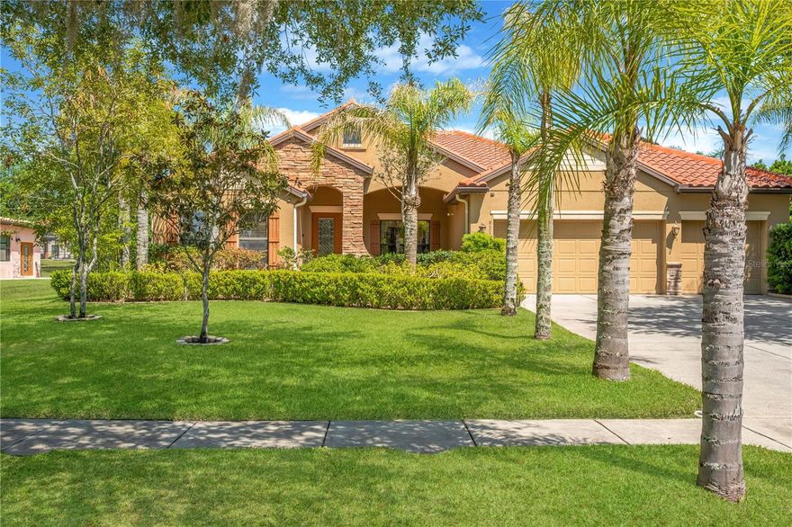One or more photo(s) has been virtually staged. Welcome to the exclusive gated community of Toulon, where elegance, privacy, and convenience come together in this stunning 5-bedroom, 3-bath, 3-car garage home situated on a sprawling half-acre lot. Impeccably maintained and rich in curb appeal, this residence welcomes you with a professionally landscaped yard, classic Spanish tile roof and stone accents, and a beautiful leaded glass front door with sidelight.
Step inside to discover a bright, open floor plan designed for both everyday living and effortless entertaining. Large-format ceramic tile flows throughout the main living areas, while rich hardwood flooring adds warmth and character to the bedrooms. Sunlight pours through the home, highlighting spacious rooms and elegant finishes throughout.
At the heart of the home is a gourmet kitchen sure to impress, featuring stone countertops, abundant cabinetry, a large center island, breakfast bar seating, and a walk-in pantry to keep everything organized. Whether hosting holiday gatherings or enjoying quiet mornings at home, this kitchen is built for connection.
Multiple living spaces offer flexibility for every lifestyle, including a formal living room/dining room for entertaining guests and a cozy family room perfect for movie nights or relaxing evenings.
The luxurious primary suite is a private retreat, complete with dual walk-in closets and a spa-inspired bath featuring dual sinks, a garden tub, and a separate walk-in shower. Additional bedrooms are generously sized and ideal for family, guests, or home office space.
Step outside and embrace Florida living at its finest on the screened and covered lanai, overlooking an expansive park-like backyard with endless possibilities—room for a future pool, outdoor kitchen, playground, or simply enjoying peaceful privacy under the open sky.
Additional highlights include a 3-car garage, irrigation system powered by a private well, sidewalks throughout the neighborhood, and an A/C system replaced in 2020 for added peace of mind.
Exceptional convenience and proximity to shopping, dining, and everyday essentials, this property perfectly blends peaceful living with easy accessibility.  Close to major highways (3 miles to I-75 and 4 miles to I-4) making commuting and travel quick and effortless. Mac Dill Air Force Base, Moffit Medical Center and University of Southern Florida are easy commutes. Disney is an hour away!  NO CDD fees and low HOA dues. Don’t miss the rare opportunity to own an oversized lot in this highly sought-after area!