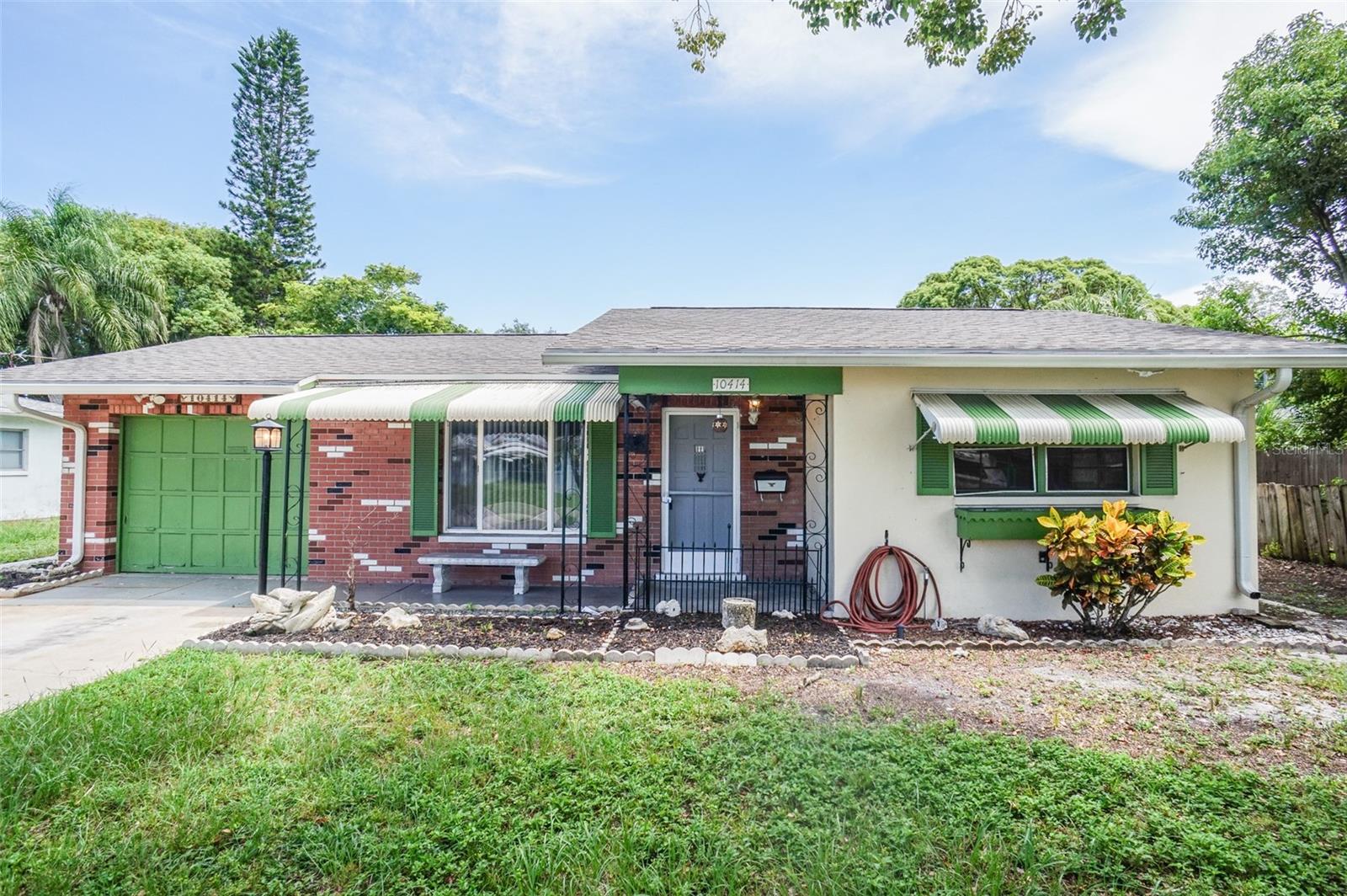 NOT IN A FLOOD ZONE! This charming home in Jasmine Lakes Subdivision offers peace of mind and plenty of big ticket item updates, making it move-in ready with tons of potential. Featuring a new roof 2025, tankless water heater, and HVAC condenser installed in 2024. Inside, you'll find a versatile den area perfect for a home office, man cave, or easily converted into a 4th bedroom. The layout is inviting and ideal for both relaxing and entertaining. Step outside to enjoy a good-sized fenced-in backyard, complete with a detached shed for extra storage or a workshop. Conveniently located less than a quarter-mile from local retail and restaurants, and just a short drive to Hudson Beach, Downtown New Port Richey, and Tarpon Springs, this home offers the perfect mix of suburban comfort and coastal access. Don't miss this opportunity—whether you're a first-time buyer, investor, or looking to downsize, this home has great potential and all the essentials already updated.