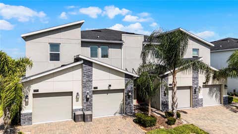 Photo of 543 Ocean Course Avenue, Davenport, FL 33896 (MLS # O6427230)