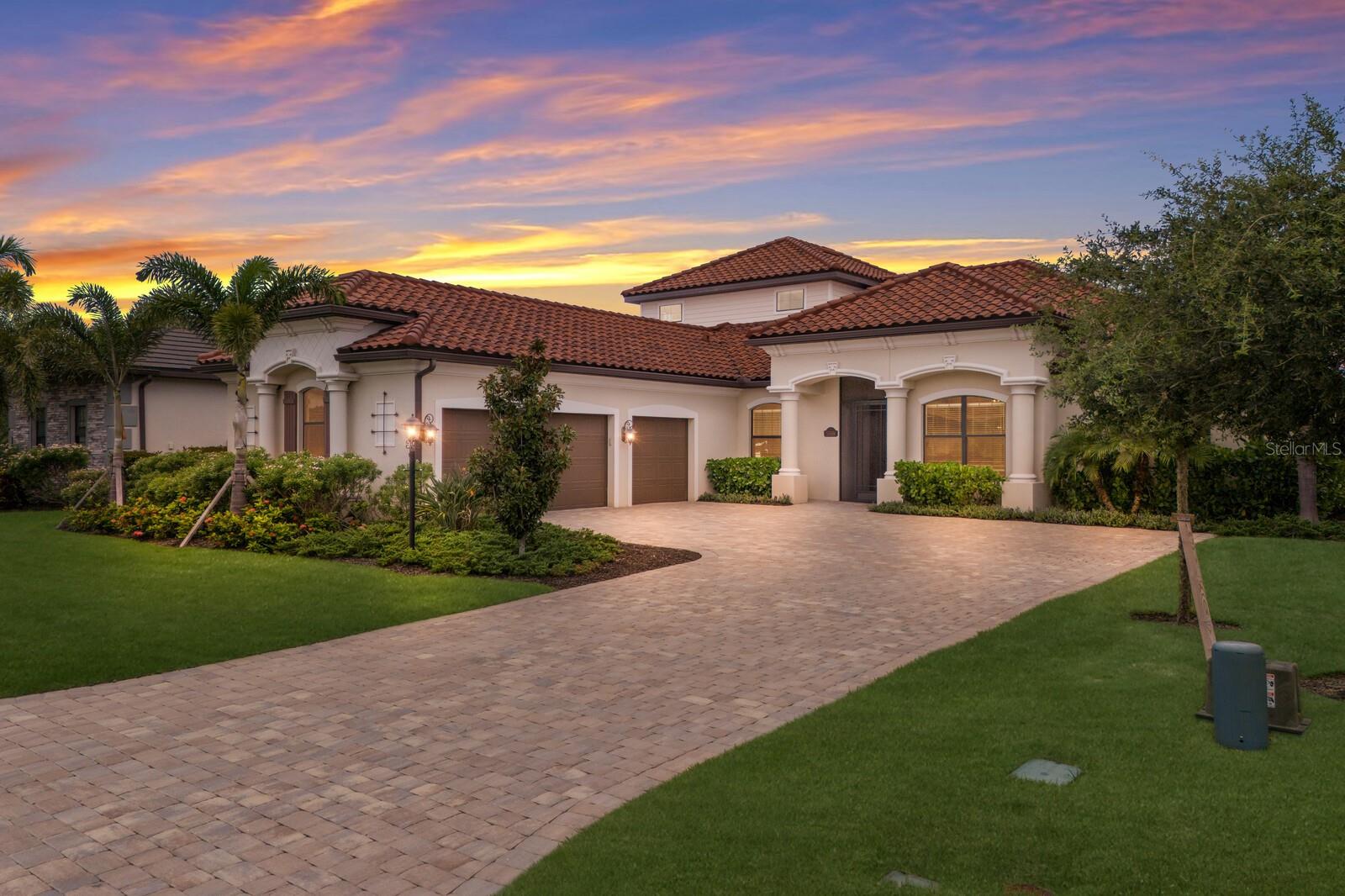 Welcome to 5569 Mulligan Way, an extraordinary two-story residence perfectly positioned on the golf course in the desirable gated community of Lakewood National Golf Club in Lakewood Ranch. This exceptional four-bedroom, 3 1/2 bathroom home with a three-car garage combines refined design with luxurious comfort, offering the ultimate Florida lifestyle surrounded by resort-style amenities and breathtaking fairway views. From the moment you arrive, the home’s inviting curb appeal and tropical landscaping set the tone for what lies inside. Step through the grand entryway into a spacious, light-filled interior where soaring ceilings, elegant finishes, and wide-open living spaces create an ambiance of casual sophistication. The expansive great room flows seamlessly into the gourmet kitchen, which is equipped with stainless steel appliances, granite countertops, a large center island with seating, custom wood cabinetry, and a pantry closet—perfect for both everyday living and entertaining guests. Walls of sliding glass doors open to a private outdoor oasis where the serene golf course backdrop enhances the tranquil beauty of the heated pool and spa. Enjoy lounging under the covered lanai, dining al fresco, or simply watching golfers make their way down the fairway from your own backyard retreat. Whether hosting guests or savoring a quiet sunny day, this outdoor living space is a showstopper. The primary suite, located on the main level, is a private sanctuary complete with large windows that frame the golf course views, large walk-in closet, and a luxurious en-suite bath featuring dual vanities, a soaking tub, and a walk-in shower. The floor offers two additional guest bedrooms anchoring a full bath, a study with french doors equipped with a closet, making it a great 5th bedroom option, a laundry room with cabinetry and stacked washer/dryer and 1/2 bath conceniently located off the pool! Upstairs, you will find a spacious fourth bedroom or bonus room offering endless possibilities—it can serve as a guest suite, media room, game room, or additional home office. With its own full bath and sweeping views over the course, it’s a versatile space designed to fit your lifestyle. Additional highlights of the home include a spacious laundry room with built-in cabinetry, a three-car garage for plenty of storage, with a separate storage room! As a resident of Lakewood National, you’ll enjoy access to one of the top golf communities in the country, including a 36-hole championship golf course designed by Arnold Palmer, a grand clubhouse with fine dining, full-service spa, state-of-the-art fitness center, resort-style pool, tennis courts, pickleball, bocce, and a full calendar of social events and activities. Lakewood National is also located within minutes of Lakewood Ranch Main Street, Waterside Place, top-rated schools, world-class shopping, fine dining, and the beaches of Siesta Key, Lido Key, St. Armands Key and Anna Maria Island. 5569 Mulligan Way is more than just a home—it’s a lifestyle. Discover the perfect blend of elegance, comfort, and recreation in this stunning golf course residence in the heart of Lakewood Ranch. Lakewood National offers sellers the option to lease their home up to twelve times a year, making it a great investment opportunity!