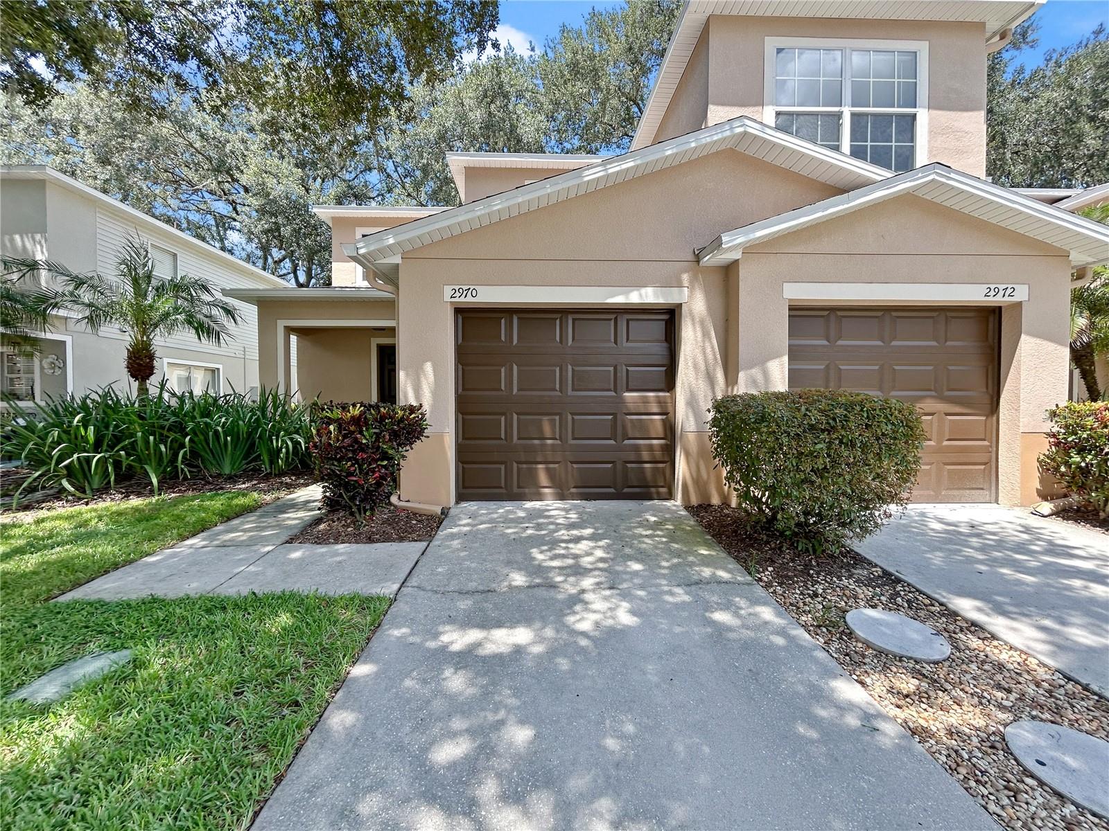 Tucked inside a quiet, well-kept community, this two-bedroom, three-bathroom townhouse offers a comfortable layout with approximately 1,300 square feet of interior space. Whether you’re hosting guests or just enjoying the day-to-day, the open-concept main floor makes it easy to unwind or entertain with ease.
Upstairs, both bedrooms offer private bathrooms, making morning routines a little less rushed—and giving everyone their own space. The primary bedroom includes generous closet space and natural light that greets you first thing in the morning (or whenever you finally roll out of bed).
Parking is a breeze thanks to your own one car garage with driveway. Additional dedicated guest parking spaces are only a short walk away—no more circling the block trying to beat your neighbor home. The well-maintained exterior and landscaping eliminate weekend yard duties, which means more time to enjoy the nearby amenities. Need groceries? The Publix Super Market at Valrico Commons is just a quick drive away. Feel like a stroll among trees instead of shelves? Valrico Park is conveniently close, providing green space for play, picnics, or peace and quiet. There’s also a nearby bus stop, adding another layer of convenience for commuting or exploring the area.
This townhome blends comfort with practicality at a price point that leaves room for living. Whether you’re a first-time buyer or looking to downsize with style, this home checks all the boxes—without checking your patience at the door. Don't miss out on this new listing that keeps everyday living smart, simple, and enjoyable.