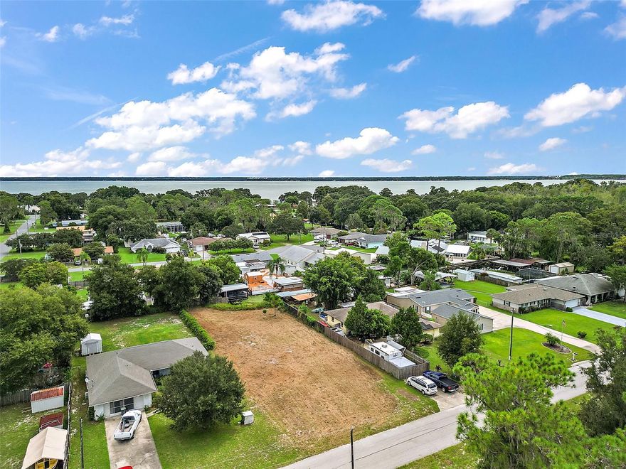 ***PRICE IMPROVEMENT***.30 acre CANAL FRONT LOT, HARRIS CHAIN OF LAKES!! Just minutes in your boat to Lake Eustis and beyond. House plans also available and included with this high and dry, cleared and level vacant lot just waiting for you to build your dream home and boathouse! Includes house plans for a 3/2, 1,437 sq ft block home have already been approved by Lake County. Come, bring your boat, RV and any other toys you have, NO HOA! The Harris Chain of Lakes is a string of 7 lakes, all interconnected. Visit the downtown areas of Eustis, Tavares (the seaplane city) or charming Mt Dora. Just go for a boat ride and fish, ski, shop, dine and enjoy the chain of lakes lifestyle that awaits you!