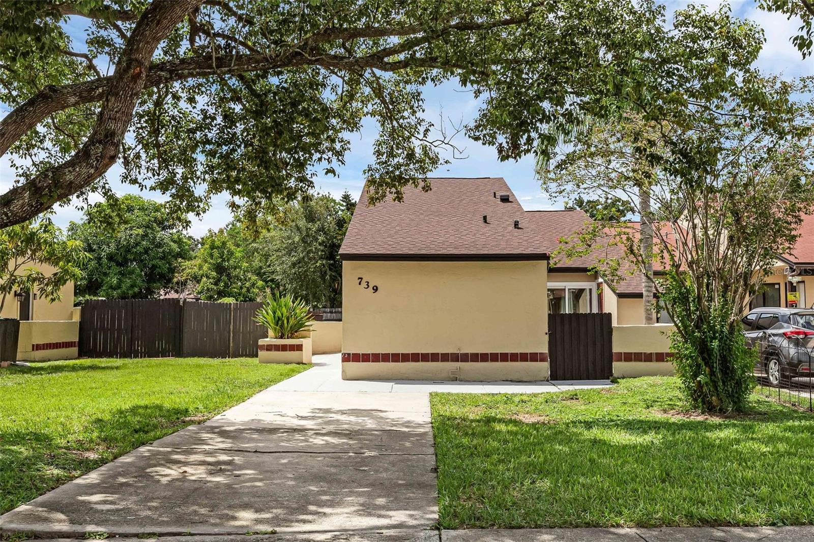 Welcome to this beautiful Completely Renovated property featuring a NEW Roof 2021, AC 2017 & Brand-New Flooring & Windows! 739 Golden Sunshine Circle is move in ready and has been renovated from the ground up, showcasing 14-foot ceilings, all-new luxury vinyl laminate flooring, and brand-new energy-efficient windows that fill the home with natural light. Four sets of sliding doors and a skylight in one bedroom add even more brightness and an airy feel.
Inside, you’ll find recessed lighting throughout and energy-efficient ceiling fans in every room. The primary suite delights with its own courtyard access and a spacious walk-in closet, while a guest room opens directly to the fenced backyard. The designer kitchen features quartz countertops, soft-close glass-front cabinets with under-cabinet lighting, and new stainless steel appliances, along with sliding doors to a private courtyard. Both bathrooms are fully updated and include sleek LED-lit mirrors.
Outdoors, enjoy a large fenced backyard with an open covered porch and a big driveway in the front with ample parking. Situated in the heart of Orlando, this home offers quick access to SR-408, I-4, and SR-417, and is close to Engelwood Elementary, Stonewall Jackson Middle, and Colonial High, making commuting and schooling convenient.