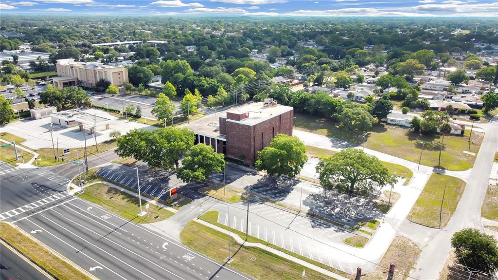 Redevelopment opportunity at the corner of US 19 and Ranch Road. Large parcel 2.81 acres available for redevelopment or improvement. Over 32,000 sq feet existing office space with drive through including 4 story office building with elevator. Rendering provided for possible car wash and gas station or future use. Build anew or augment the current structure to suit your needs. Daily traffic counts of 51,000+ vehicles offers great visibility for your business. Tons of potential for future use.