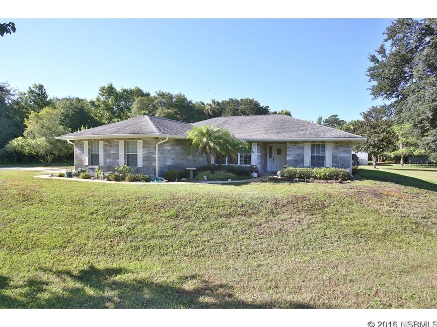 Custom block home built on 3.80 acres.  Property is completely cleared with beautiful oaks, Magnolias, Maple and more.  Sit by one of the two ponds and enjoy the view..  House boasts great room with large kitchen that has room for the family.  The breakfast bar is 13.4 long.  Step out of the great room through a set of French doors to the covered screened porch big enough to host parties and events.  From the porch you can take in the peaceful setting of the back pasture.  Also located in the back half of property is a 32x24' detached garage  or workshop for all your toys and tools. Window AC in workshop could be guest apt or office. The house has a double car garage, good sized laundry room, and two pantries. And for emergencies the home is equipped with two generators.  One generator for the house and one for the well. Water softener was replaced in the past three years. This pristine home has been well maintained and is move in ready. Bring your horses, boats, rv's, and more.