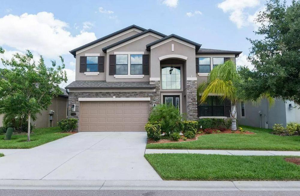 Stunning 3700 s.f. POND VIEW 5/3 home in Riverview, only 25 minutes to downtown Tampa. This luxurious home is clad with stone countertops throughout, brand new carpet, drawers throughout kitchen and butler's pantry with a brand new range and dishwasher, a gorgeous custom-built electric fireplace (heat optional), loads of electrical and lighting upgrades, SOLAR POWER for low energy bills, a massive 1st floor In-Law suite, HUGE closest throughout, lots of storage, and LOW HOA ($65/mo), and NO CDD fees! This gorgeous home is also located in a NO EVACUATION zone during hurricanes, and NO FLOOD ZONE for optimal homeowner's insurance rates; but also includes hurricane shutters.
This spacious 3700sf home overlooks a lovely pond in the beautiful ESTUARY community in Riverview Florida and is only 25 minutes to downtown Tampa. This spacious home has brand new carpet throughout, offers 5 huge bedrooms with LARGE walk-in closets, 3 full bathrooms, a large living room with a dazzling $15,000 mother of pearl custom electric fireplace and wired with in-ceiling speakers for surround sound, huge game room (upstairs and wired with in-ceiling speakers for surround sound, and pre-wired and plumbed for a full upstairs entertainment center and wet bar), breakfast area off the granite-clad kitchen (under and over cabinet lighting), formal dining room with in-ceiling sound (or flex room), magnificent $3,500 chandelier in the entry way surrounded by $20,000 in wood / iron stair railing throughout (no knee walls!), ceiling fans throughout, and a screened lanai overlooking the pond. Huge master suite with large walk-in closet and jetted garden tub also overlooks the lake for serene views every day! There is also a huge bedroom (second master / in-law suite) on the bottom floors with a 12' x 6' walk in closet just off the downstairs guest (full) bathroom with walk-in shower. Garage offers 2.5 spaces and is wired with GFIs for a 8' x 12' workshop (or you can use this 8' x 12' space for storage). This house also features over $20,000 in lighting / electrical / sound upgrades, as well as a $40,000 solar power system with a back-up battery - very energy efficient and low electric bills! It's also plumbed for a water-softening system and has a nearly new water heater (1.5 years old).
You need storage - this house has HUGE closets, and has a GLAM under-stairs storage room that has been completely finished with shelves, lighting, and a sparkling light switch! The garage also has a half parking space that can be used for storage, or built into a workshop!
The gorgeous backyard overlooks a community pond and has enough space to build a swimming pool with a hot tub (100 amp electrical box is already installed on the back of the house and ready for you to build the pool of your dreams).
This home does not include a refrigerator, and there is a possibility that a washer and dryer may be included (Owner / Seller might be able to include this, but not a guarantee at this time).
This Home is a MUST SEE!!
