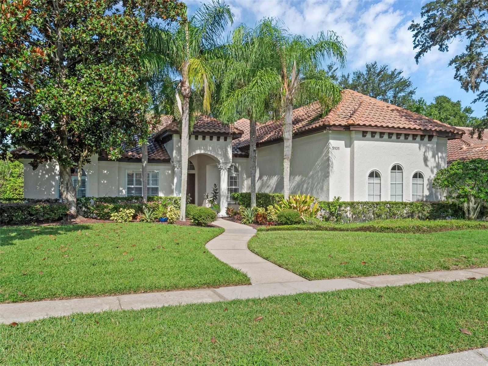 BEAUTIFUL & SPACIOUS * Custom * Executive Home offering a Fabulous ~ Solar Heated POOL & SPA ~ Located in the Coveted ~ DR. PHILLIPS area of Orlando, where Charm meets Convenience in the sought-after GATED neighborhood of Kensington Park with Alluring Tree-Lined Streets & situated on almost a * 1/3 ACRE * Perfectly PRIVATE Lot with no Rear Neighbors.
Fabulous 5 Bedrm + Flex Room, 4 Bath home offers Everything ON THE FIRST FLOOR except a large Bonus / 5th bedrm & Bath upstairs. Upgraded & Updated with Gorgeous * Brazilian HARDWOOD Floors* throughout Living Areas & All Bedrooms * New A/C – 2024 * Exterior Painted-2022 * Tankless Hot Water Heater–2017 * Interior Painted-2020 * Refinished Cabinets 2019 * Upgraded Pebble Pool Surface – 2019 * Solar Added for Pool & Spa Heater– 2020 * Upgraded Paver Patio & Pool Decking – 2019 * 3 Car Garage & More!
As you approach this Architectural Beauty, lush landscaping & a private walkway greet you, providing a sense of Tranquility & Privacy. Upon entering the double wood doors, you’ll be Captivated by the Elegant Design & Impeccable Craftsmanship that defines this Quality Custom Reiche Silliman residence. The Foyer leads you into an Open Concept living area adorned with stunning WOOD Floors, High Ceilings & Large Windows offering an abundance of Natural Light & creating an inviting atmosphere that Seamlessly Blends Indoor & Outdoor living.
The Gourmet Kitchen offers a 5 Burner GAS COOK TOP, 42” Cabinets w/ Crown Molding, Stainless French Door Refrigerator, Convection Oven, Walk in Pantry, family dinette, Bar Seating & More. Adjacent to the kitchen is an elegant dining room w/ Upgraded Light Fixtures & Wood Floors perfect for family meals or entertaining guests. A Spacious & Inviting Family Room offers Wood Floors, a Gas FIREPLACE, Custom Built Ins & Triple Sliding Glass Doors that seamlessly pocket back to disappear giving you true indoor / outdoor living. Phenomenal Floor Plan w/ the majority of rooms on the FIRST FLOOR including a Primary Suite that is a True Sanctuary, w/ Beautiful HARDWOOD floors, Sitting Area, 2 Walk In Closets & a Spa-Like Primary Bathroom designed to Pamper & Rejuvenate. Plenty of room for everyone with 3 additional Bedrooms Downstairs w/ Bathroom access & a Fantastic Flex Room currently used as an Exceptional Closet w/ amazing Custom Cabinets. Upstairs is a Large BONUS / 5th Bedrm & full bath making this a fabulous Multi-Generational Living Area, In-Law or Student Suite. Enjoy outdoor Florida living at its Best in this lush Private setting, Relaxing in your Sparkling * Solar HEATED POOL and SPA. Unwind & Indulge in this PRIVATE Outdoor Oasis with an Expansive Screened Lanai Perfect for Alfresco Dining & entertaining. Imagine soaking up the Florida Sunshine by day & gathering with loved ones under the Stars by Night. Plenty of BACKYARD space for Everyone to Enjoy.
PREMIER LOCATION in Desired DR. PHILLIPS. Just minutes to UPSCALE Shopping, Famed Restaurant Row * DISNEY WORLD * UNIVERSAL Studios, Epic Universe, Theme Parks, World Class GOLFING & Nestled next to Windermere w/ Farmers markets, Food Truck Events & the Butler Chain of Lakes. Easy Access onto Major Roads to get you quickly to Orlando International Airport, the Space Coast, Sunny BEACHES & anywhere you want to go. Unparalleled Community of 138 Custom Homes in a Private Gated Enclave offering Tennis Courts, Playground & Pickle Ball Courts. Exceptional Home in a Prime Location with Top Schools. Welcome Home!