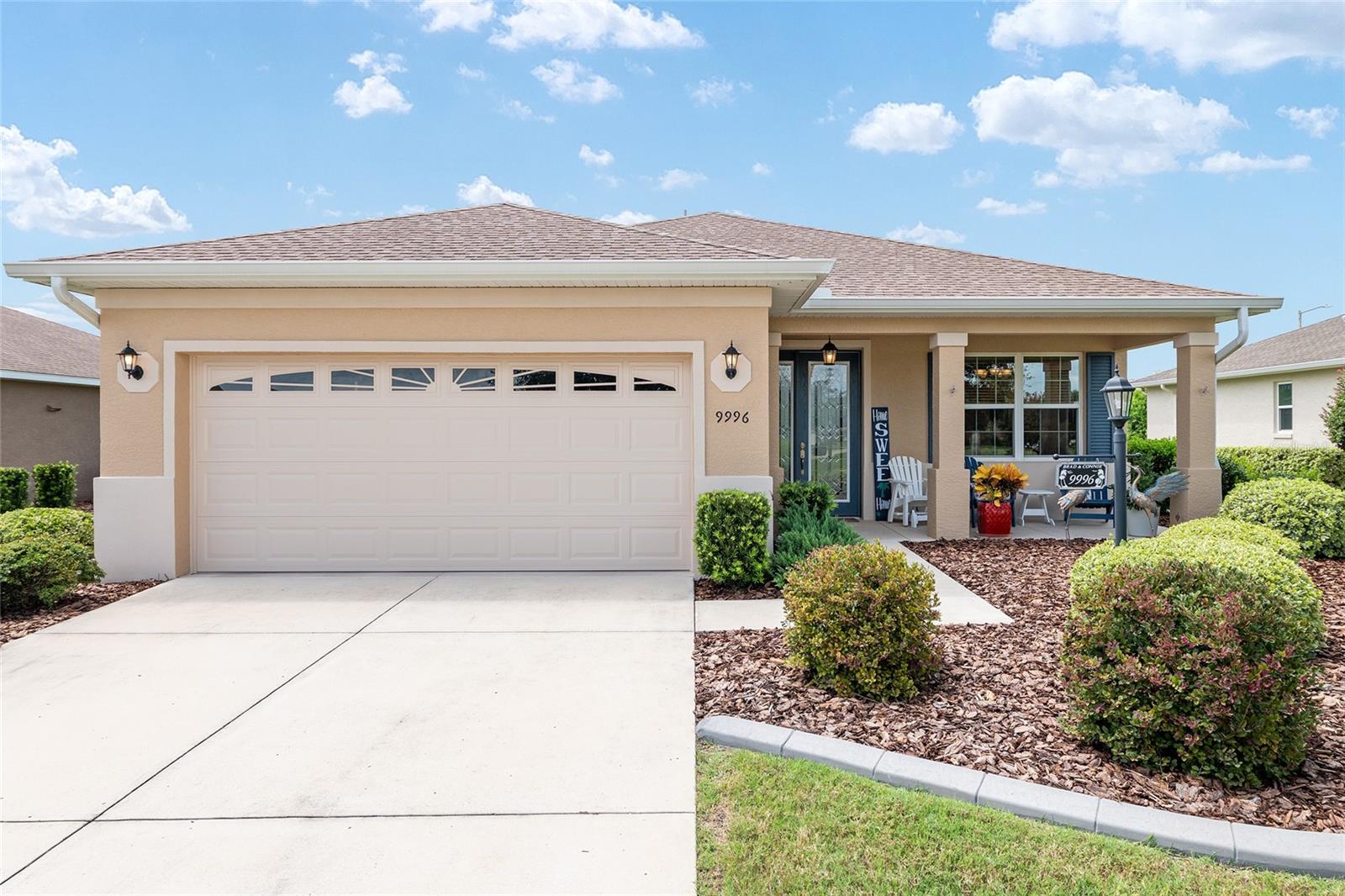 Welcome to this beautifully maintained Kent model in the Avalon 4 community. This 2-bedroom, 2-bath home with a 2-car garage features stylish upgrades, modern finishes, and a peaceful golf course view with no front neighbors. The open layout showcases luxury vinyl plank flooring, crown molding, ceiling fans, and plenty of natural light. The kitchen offers dual-toned, staggered cabinetry with crown molding, a tile backsplash, granite countertops with pendant lighting, and Whirlpool stainless steel appliances including a gas range and microwave. A pantry and eat-in dining area with window blinds add to the functionality. The living room opens with sliders, also fitted with blinds, to a screened lanai with a ceiling fan and pull-down shades, all overlooking landscaped privacy hedges. The primary suite includes a ceiling fan, 2 windows with blinds, a walk-in closet, and an en suite bath featuring a zero-entry tiled shower with bench, dual quartz sinks, tile flooring, and a linen closet. The guest bedroom offers a Murphy bed with built-in desk, a closet, and window blinds, while the 2nd bath provides a tiled tub and shower combination, quartz sink, wood cabinetry, and tile flooring. A hallway closet provides extra storage, and the laundry closet is equipped with a Maytag washer and dryer. The 2-car garage features an epoxy-coated floor, and the home is complete with gutters, curbed landscaping, and a private setting with golf course views in the front and privacy hedges in the rear. Located in Ocala's premier, gated, active 55+ community, loaded with amenities, including golf cart access to 2 shopping centers.