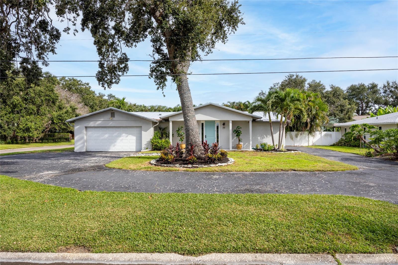 Broadwater is booming, and this custom-upgraded pool home puts you at the heart of one of St. Petersburg’s most exciting neighborhoods for growth, convenience, and coastal living.
No stone was left unturned in this thoughtful, top-to-bottom remodel. Set on an oversized corner lot, this block-construction 2 bedroom, 2.5 bath ranch-style POOL home lives large with an open concept layout where the living room and chef’s kitchen flow seamlessly together. Walls of oversized, impact windows frame the tropical backyard oasis and bathe the interiors in natural light. The entertainer’s kitchen features custom wood cabinetry with oversized soft-close and spice drawers, a dramatic 10x5 island with farmhouse sink, dishwasher and extra storage/seating, striking quartzite countertops, and premium KitchenAid appliances—including a 36" 6-burner gas range, 5-door refrigerator, combo wall oven/microwave, plus a wine fridge and ice maker in the butler’s pantry.
Porcelain tile flooring carries throughout. The split plan offers two spacious bedrooms, each with an ensuite bath, plus a convenient half bath that opens to the screened lanai for easy pool access. The serene primary suite provides a custom walk-in closet, sitting area, and a spa-worthy bath with dual vanities with quartzite countertops, a marble walk-in shower boasting four niches, and a Victoria + Albert Marlborough double-ended slipper tub overlooking the lush landscape including 30+ Eureka palms—designed for everyday resort living.
Enjoy glimpses of Boca Ciega Bay from the dining area and the primary suite and prepare for sunsets that will take your breath away. Arrive through the garage to a charming laundry/mudroom with a custom farmhouse sink. Outdoors, Florida living shines: a large screened porch (accessed by a sliding pocket door) overlooks the sparkling pool and fully fenced, private backyard, complete with a Meyer lemon tree.
Notable upgrades include a 2017 metal roof, a Trane 3.5-ton HVAC with transferable 10-year warranty (installed 2021), updated plumbing and electrical, water softener, tongue-and-groove pine ceiling accents, Moen fixtures, crown moulding with upgraded trim/baseboards, solid wood interior/exterior doors, a security-minded front door with triple deadbolt and insulated sidelights, designer lighting, extensive LED recessed and under-cabinet lighting, refreshed exterior stucco, gutters with guards and soffits, pool equipment updates, newer toilets, exterior security cameras and motion lighting, added insulation, new ceiling fans, and a wide driveway with extra guest and boat/RV parking.
All of this in a superb location a few blocks to the multi-million-dollar Maximo Marina, close to waterfront dining, and just minutes to St. Pete Beach and vibrant Downtown St. Petersburg, with quick I-275 access for easy commutes and airport runs. Come experience Broadwater’s best—schedule your private tour and make this stunning residence your new place to call home.