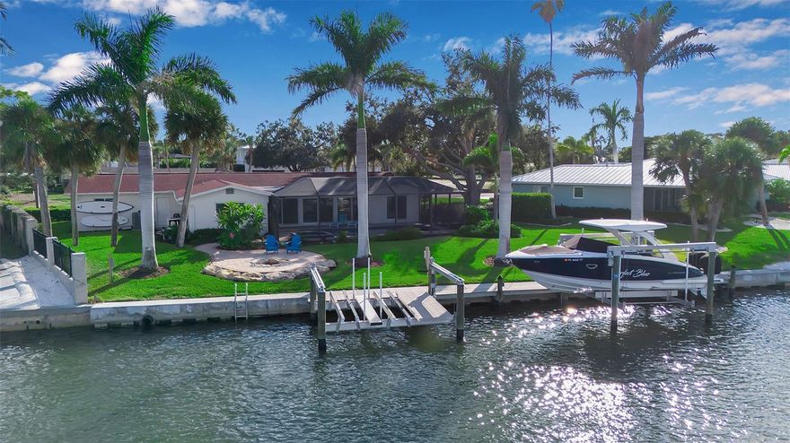 Calling all boaters—this is the waterfront opportunity you’ve been waiting for. Perfectly positioned at the end of a private cul-de-sac on desirable Venice Island, this move-in ready 4-bedroom one level home sits directly on the Intracoastal Waterway with wide-open views of Roberts Bay and just a five-minute boat ride to the Gulf from your private dock.
Designed for effortless waterfront living, the property features a brand-new 2024 seawall and a remote-controlled double jet-ski/kayak lift (2024–2025), making it easy to launch, store, and enjoy your watercraft. Cruise to the Gulf, explore the Intracoastal, or head out for waterfront dining—all from your backyard.
The outdoor space is built for relaxation after a day on the water. A redesigned heated pool and spa—both operated by remote—overlook the bay, creating the perfect setting for sunset swims and entertaining. Mature tropical landscaping enhances privacy while keeping the focus on the stunning water views.
Inside, this updated ranch blends comfort with modern upgrades. Renovated in 2017–2018, improvements include a new roof, Miami hurricane-grade windows and sliders, full re-plumbing and electrical, new flooring, and updated systems including AC and water heaters (2018). A new pool pump (2024) and fresh interior and exterior paint (2025) make this home truly move-in ready.
The light-filled layout offers large foyer windows, wood-look tile flooring, recessed lighting, and an inviting Florida room with exposed beams. The open kitchen features wood cabinetry, stone counters, and stainless steel appliances—ideal for gathering with family and friends.
With four bedrooms and 2.5 baths—including a serene owner’s suite with pool access and beautiful water views—this home offers easy, single-level living with space for guests.
Just a short walk to beaches, dining, shopping, and entertainment, this waterfront ranch delivers the ultimate combination of boating access, convenience, and relaxed island living.
Schedule your private showing today and start enjoying life on the water.
